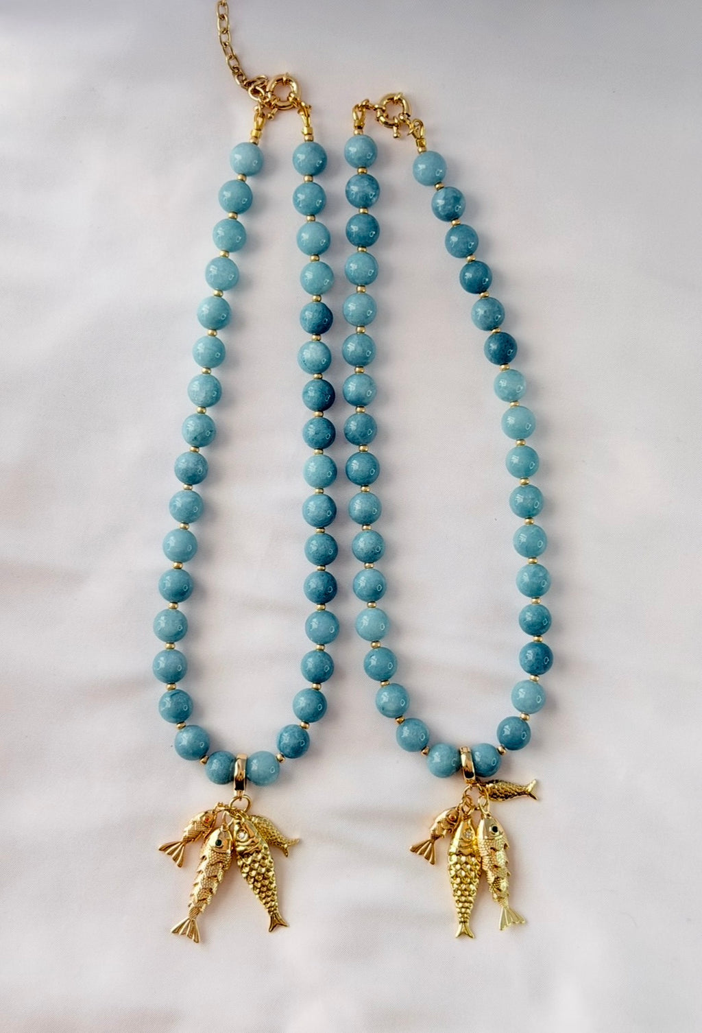 The Golden Catch Necklace: Sea blue Jade with Gold Fish Charms