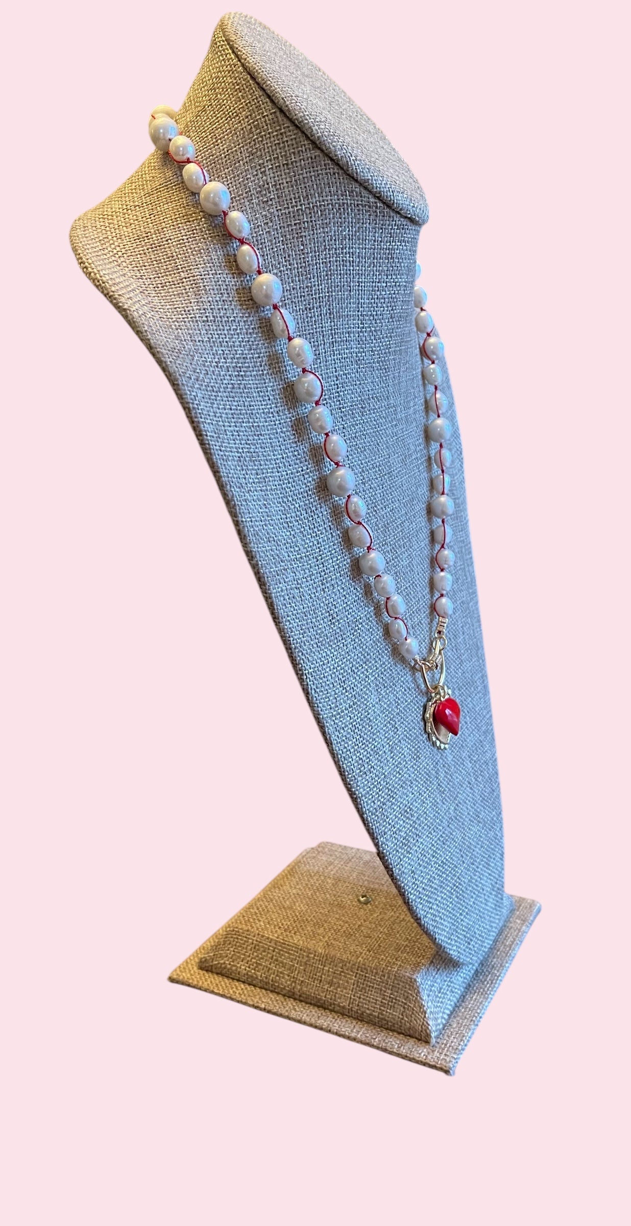 The Heartstrings Necklace: Luminous high quality freshwater pearls hand knotted on red silk w/ gold and red enameled heart charms, pavé accented clasp/charm holder OOAK