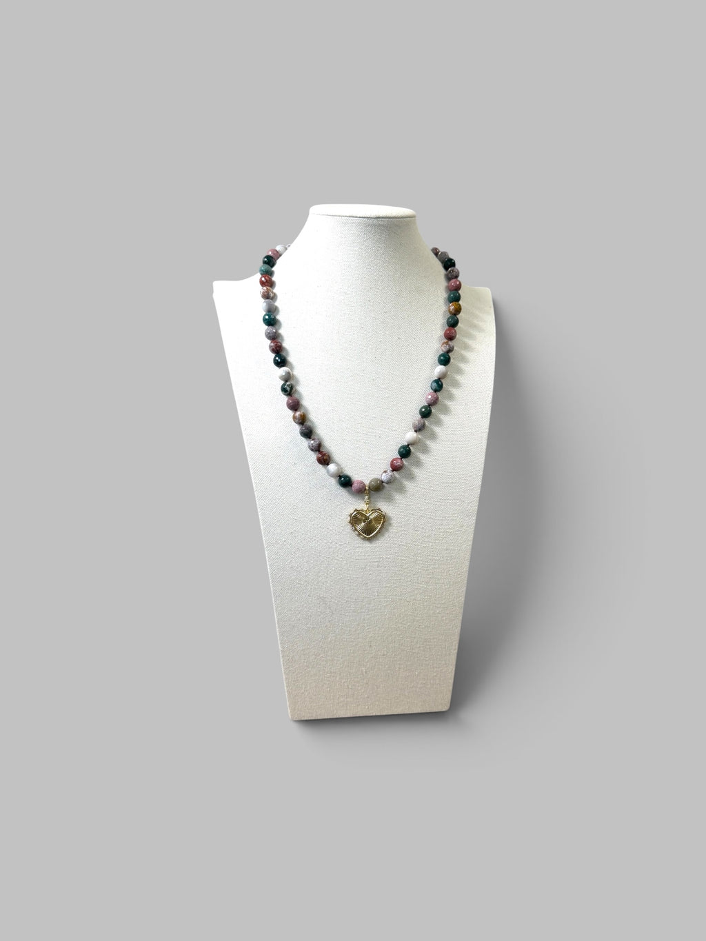 Heart & Soul Necklace: Faceted Ocean Jasper handknotted on deep burgundy. Removable gold heart