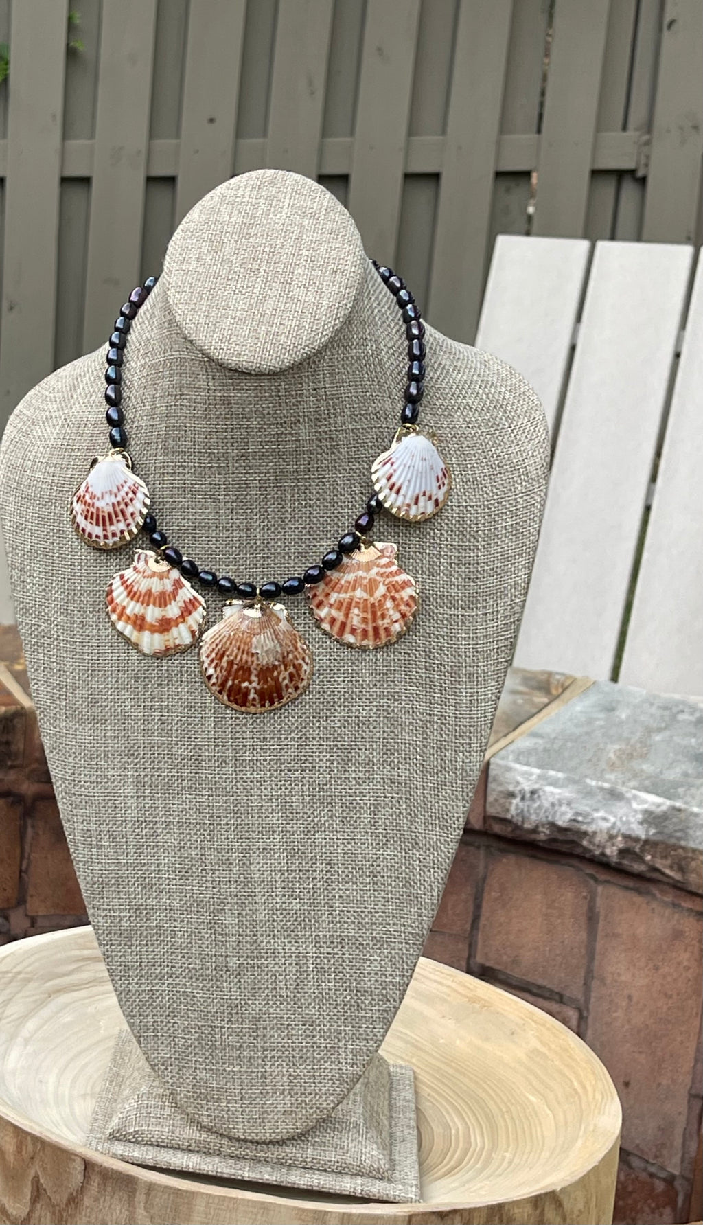 Midnight on the Beach Necklace: Midnight blue freshwater pearls with natural Lions Paw seashell pendants