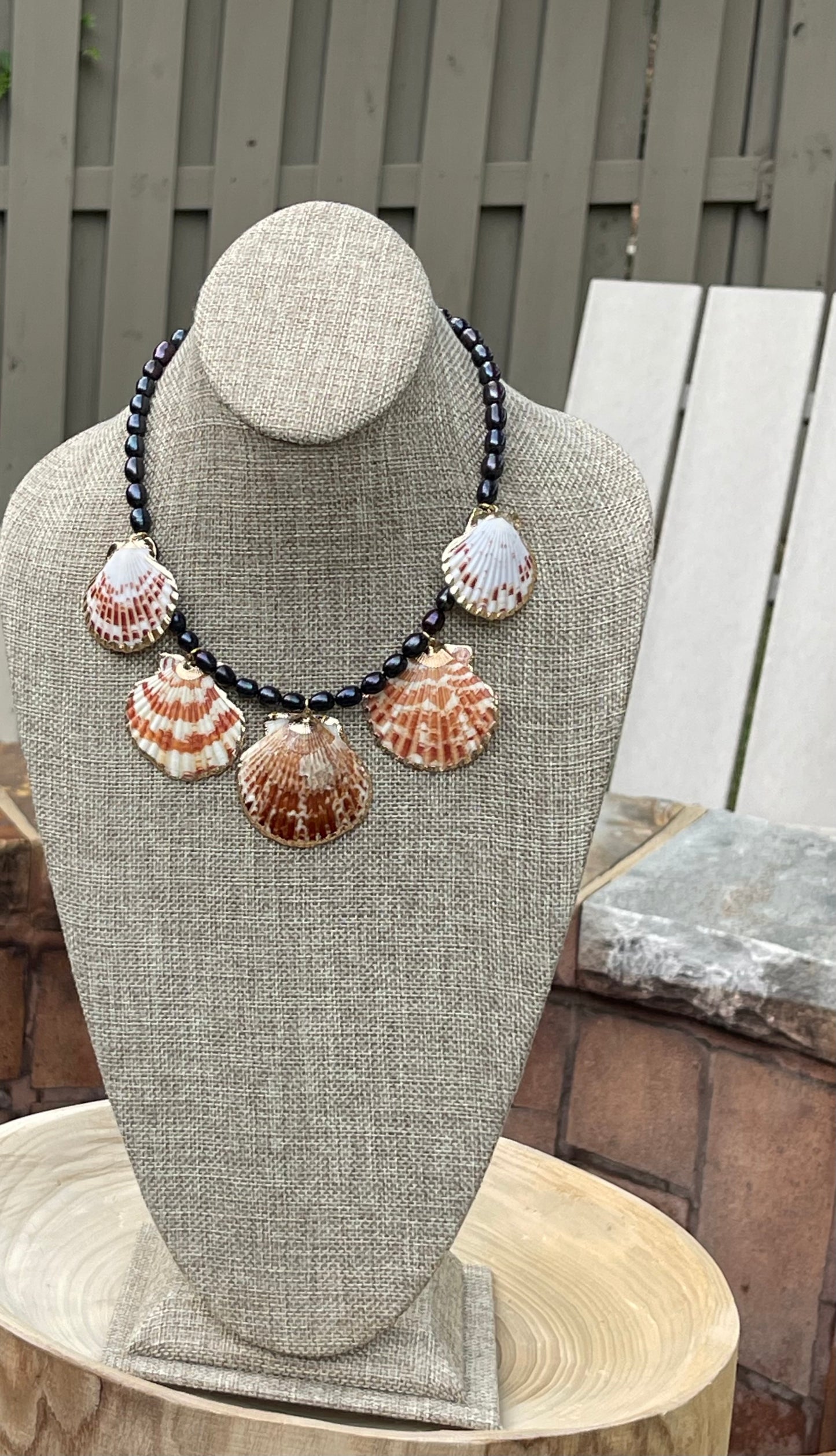 Midnight on the Beach Necklace: Midnight blue freshwater pearls with natural Lions Paw seashell pendants