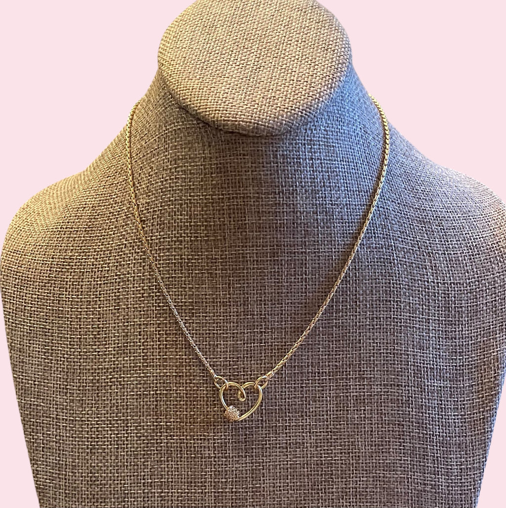 Be Still My Heart Necklace: A thin gold cable chain w/ an adorable heart that doubles as a clasp and a charm holder Pavé screw closure OOAK