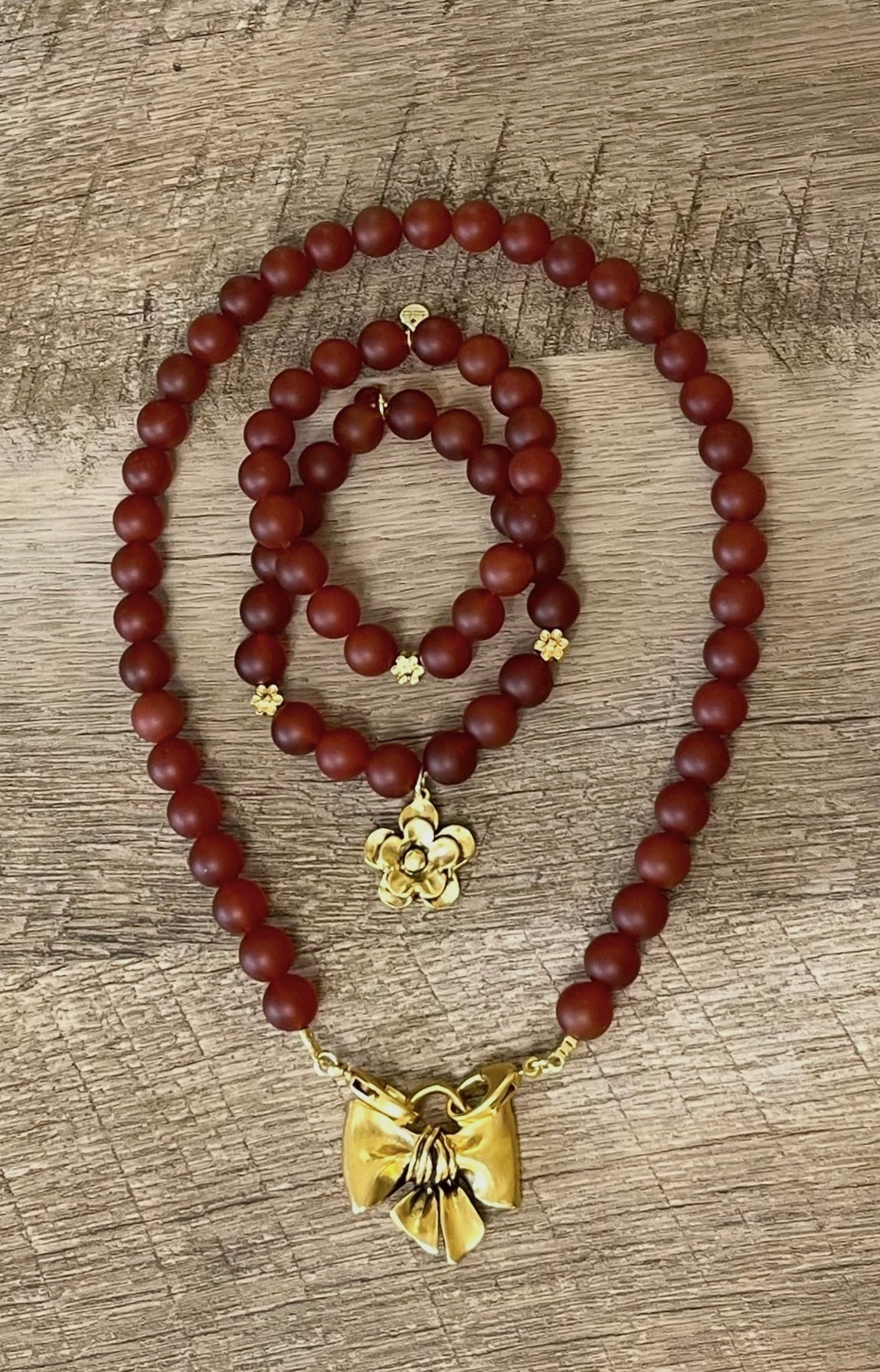 Matte Carnelian Bow Necklace: Matte Carnelian gemstone beads Antiqued gold bow pendant