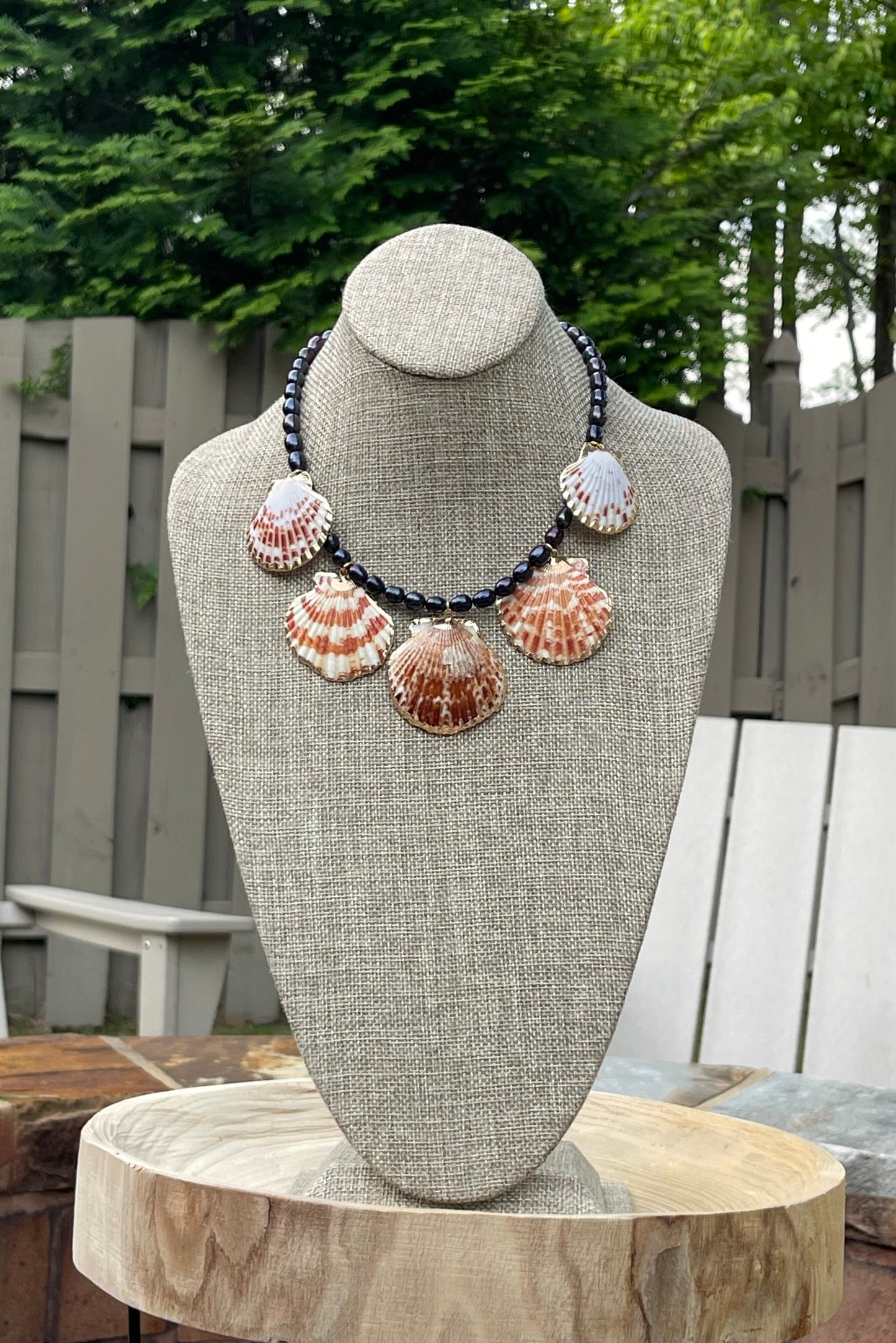 Midnight on the Beach Necklace: Midnight blue freshwater pearls with natural Lions Paw seashell pendants