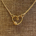 Be Still My Heart Necklace: A thin gold cable chain w/ an adorable heart that doubles as a clasp and a charm holder Pavé screw closure OOAK