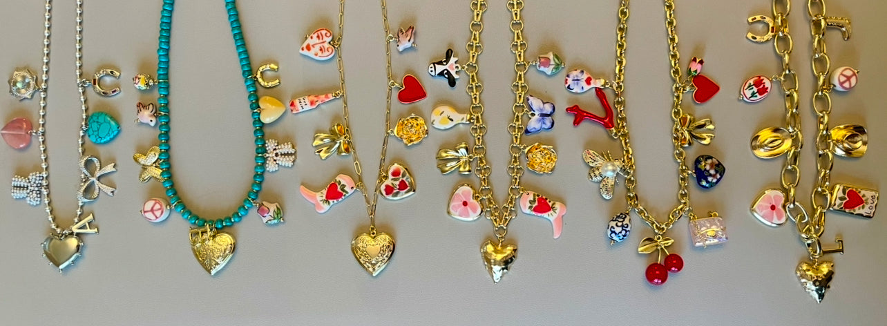 The Jackie Necklace: Tarnish resistant gold chain with various charms in a red pink & blue theme