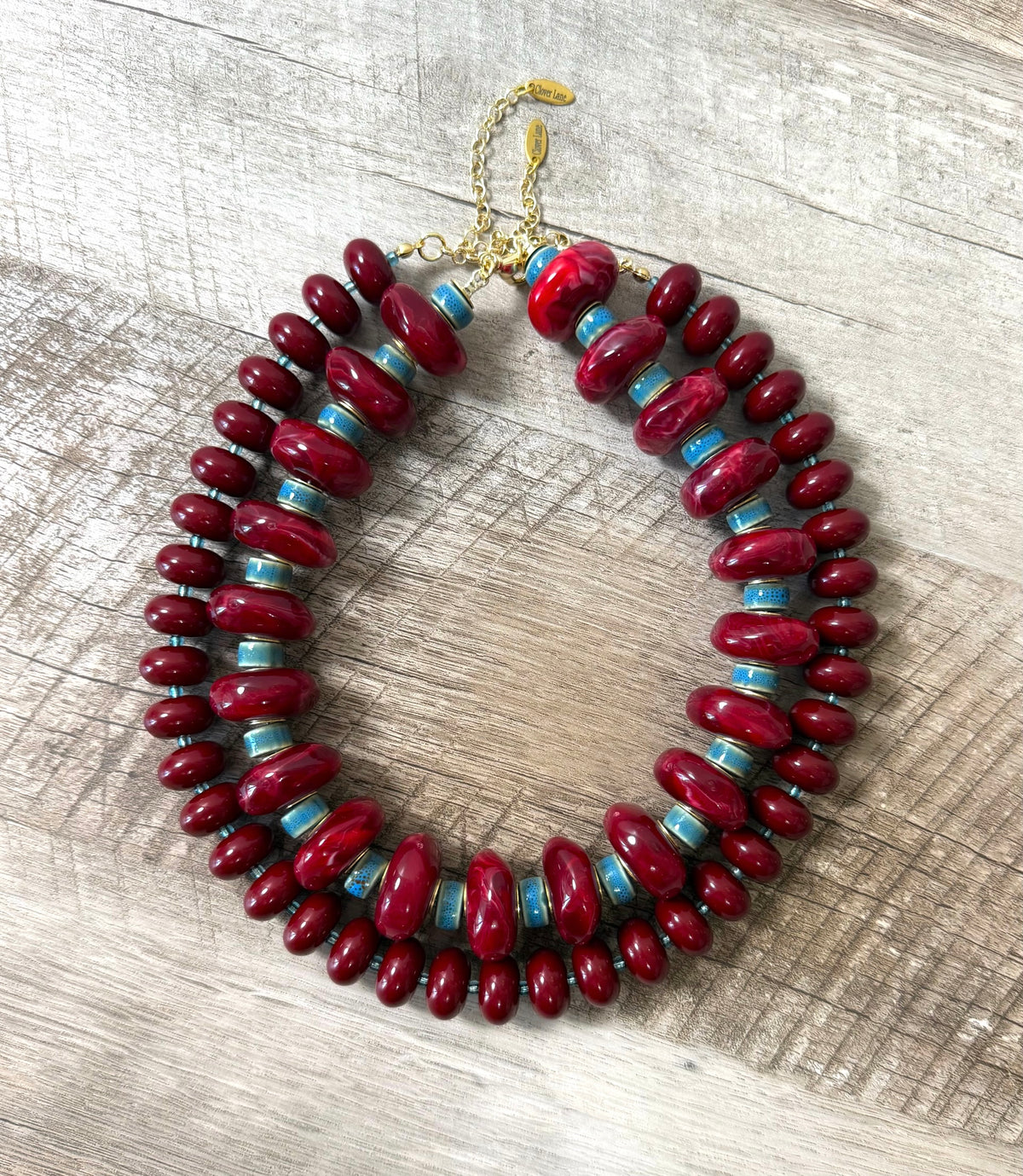 Bordeaux & Blue: Resin beads with denim blue faceted seed beads Gold clasp & extender