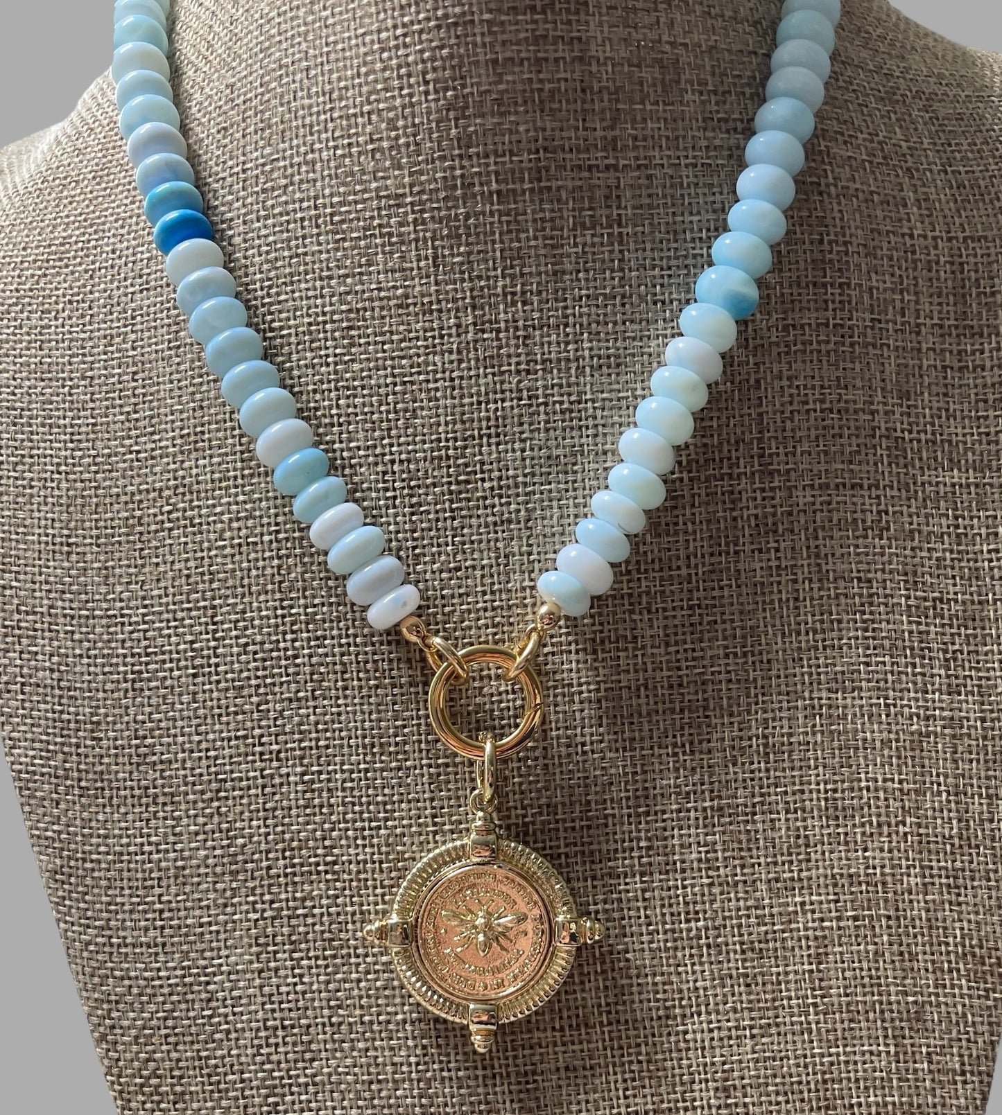 The Skylar Necklace: Sky Blue Opals with a Gold Circle Clasp and French Bee Coin Style Charm