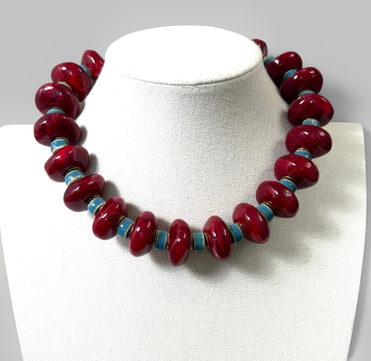 Crimson & Coast: Resin and Ceramic beads with gold brass accents and clasp