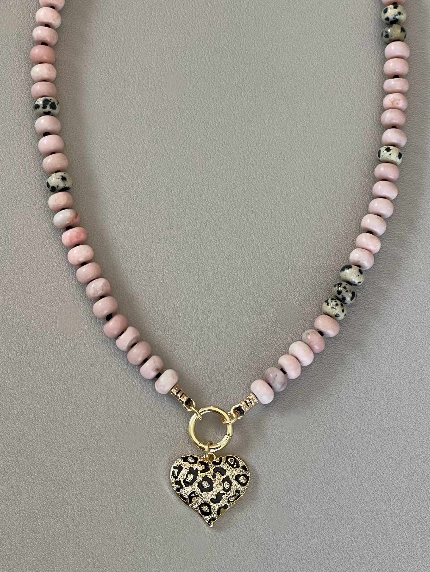 The Pink Leopard Necklace: Natural matte pink opals hand knotted on black silk w Dalmatian Jasper accents Gold pavé leopard heart OOAK