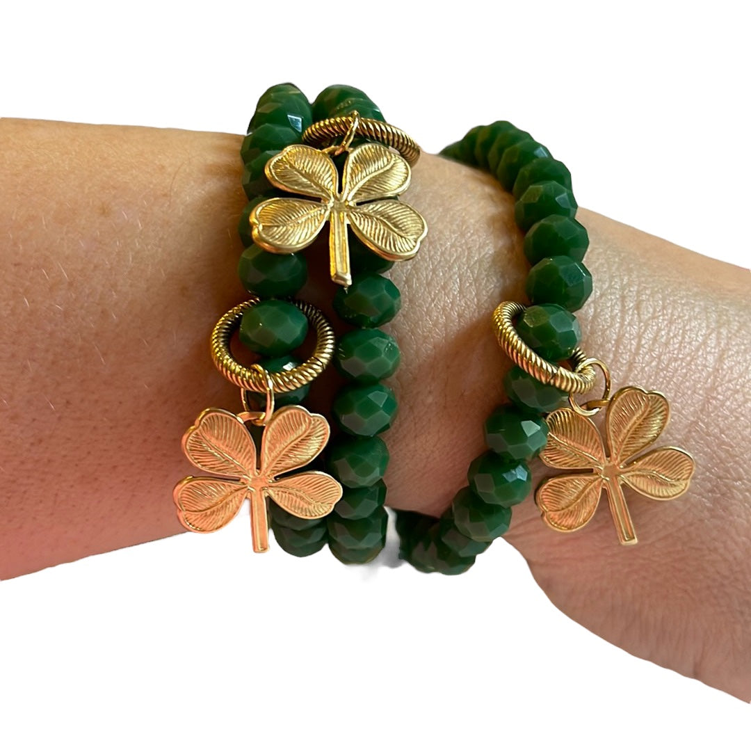 Lucky Charm Bracelet: Gorgeous tone of green in a faceted acrylic beaded stretch bracelet with a solid brass charm