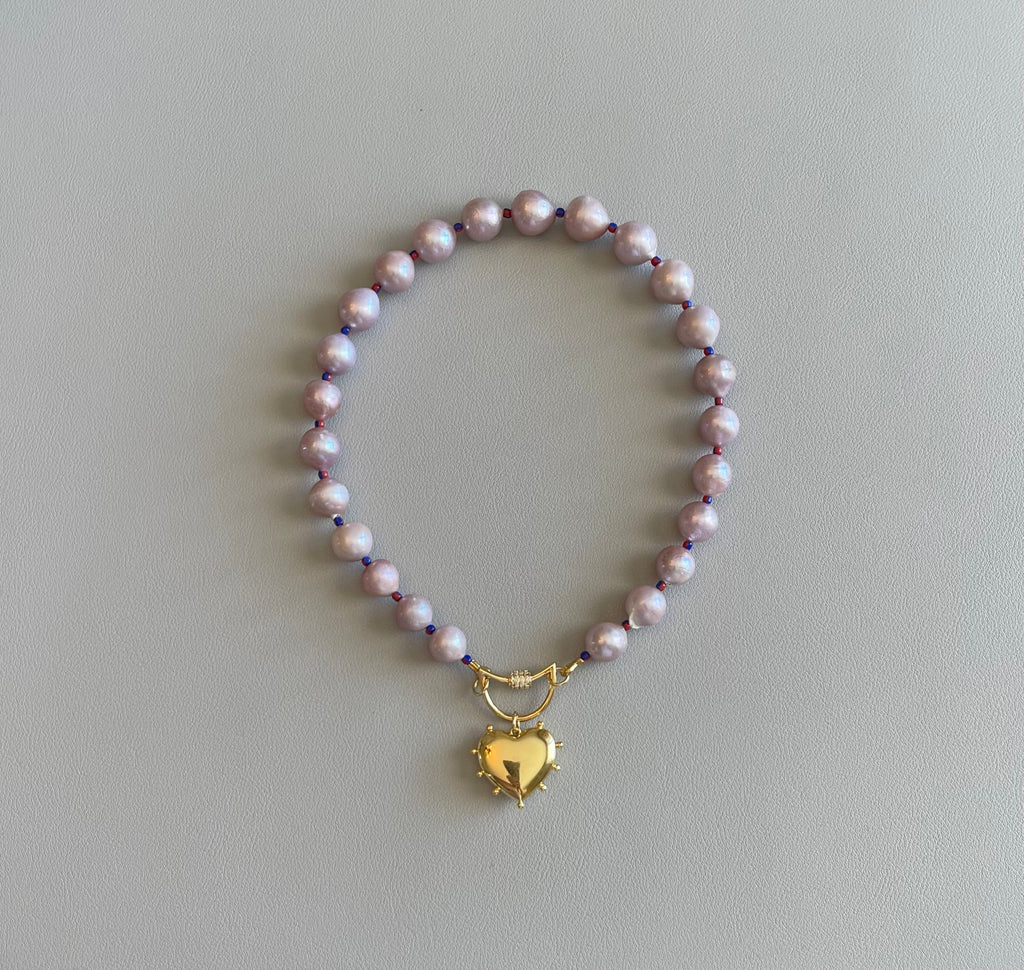 The Yves Necklace: Lavender Edison Pearls w/glass spacers, a gold crescent clasp holding a heart pendant OOAK