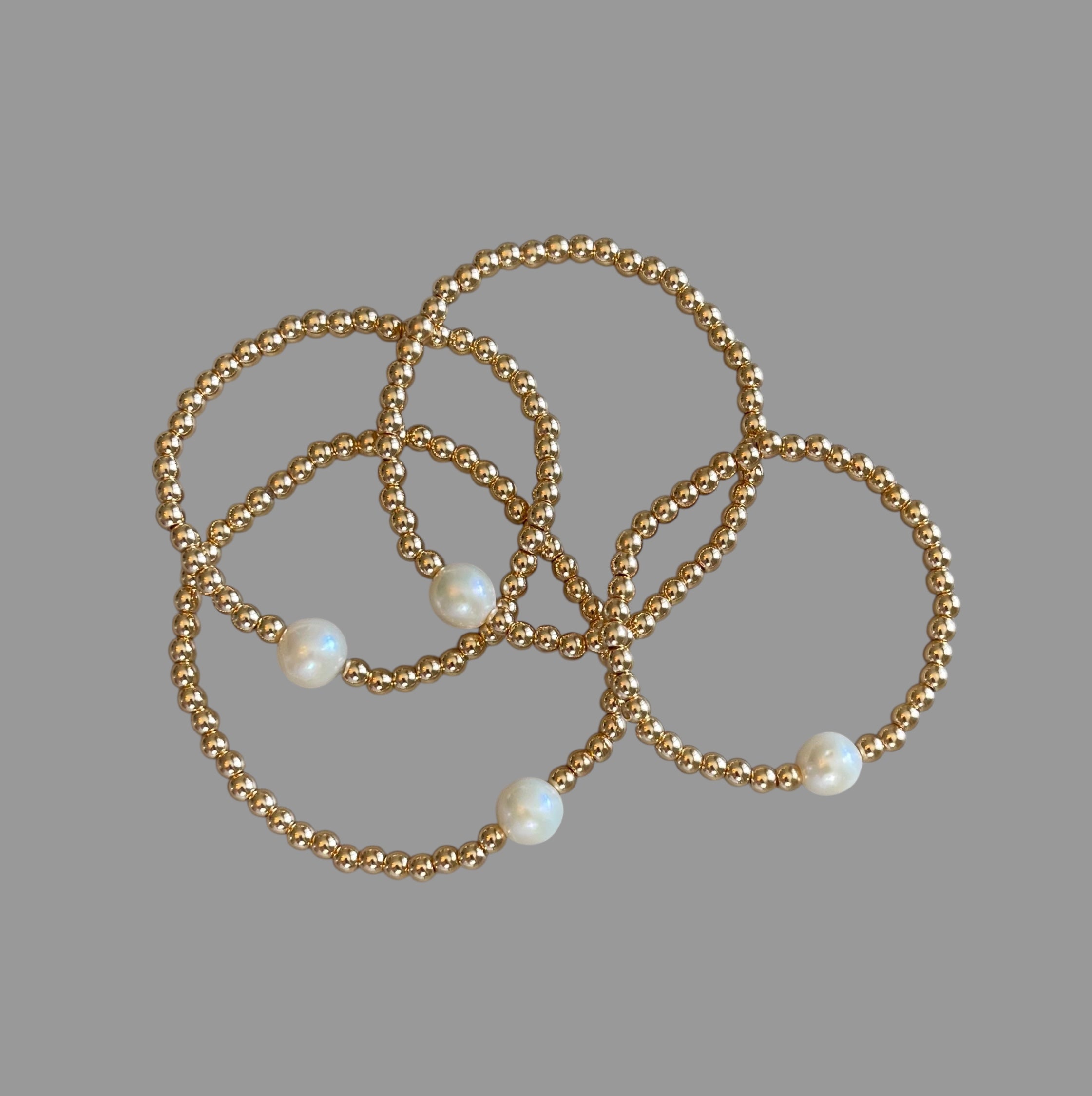 Everyday Hero Bracelet: Gold bead stretch bracelet with a freshwater pearl centerpiece Choose your size!