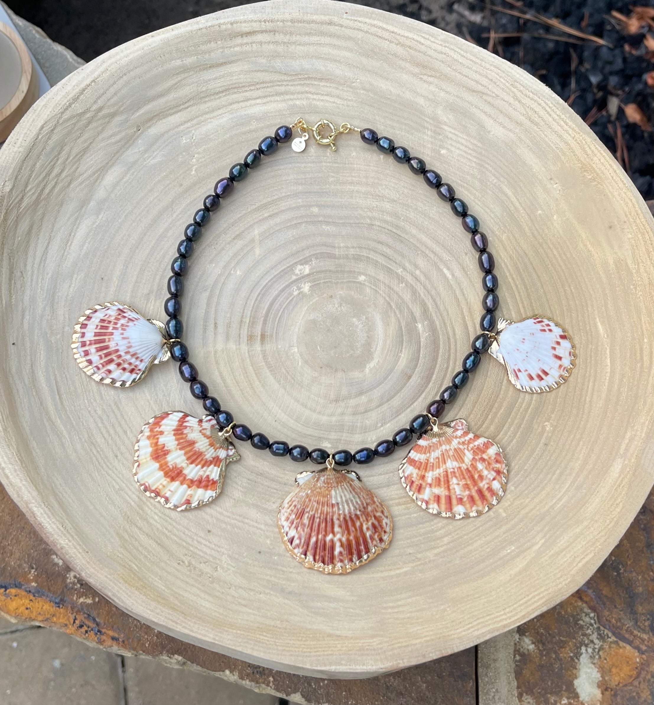 Midnight on the Beach Necklace: Midnight blue freshwater pearls with natural Lions Paw seashell pendants