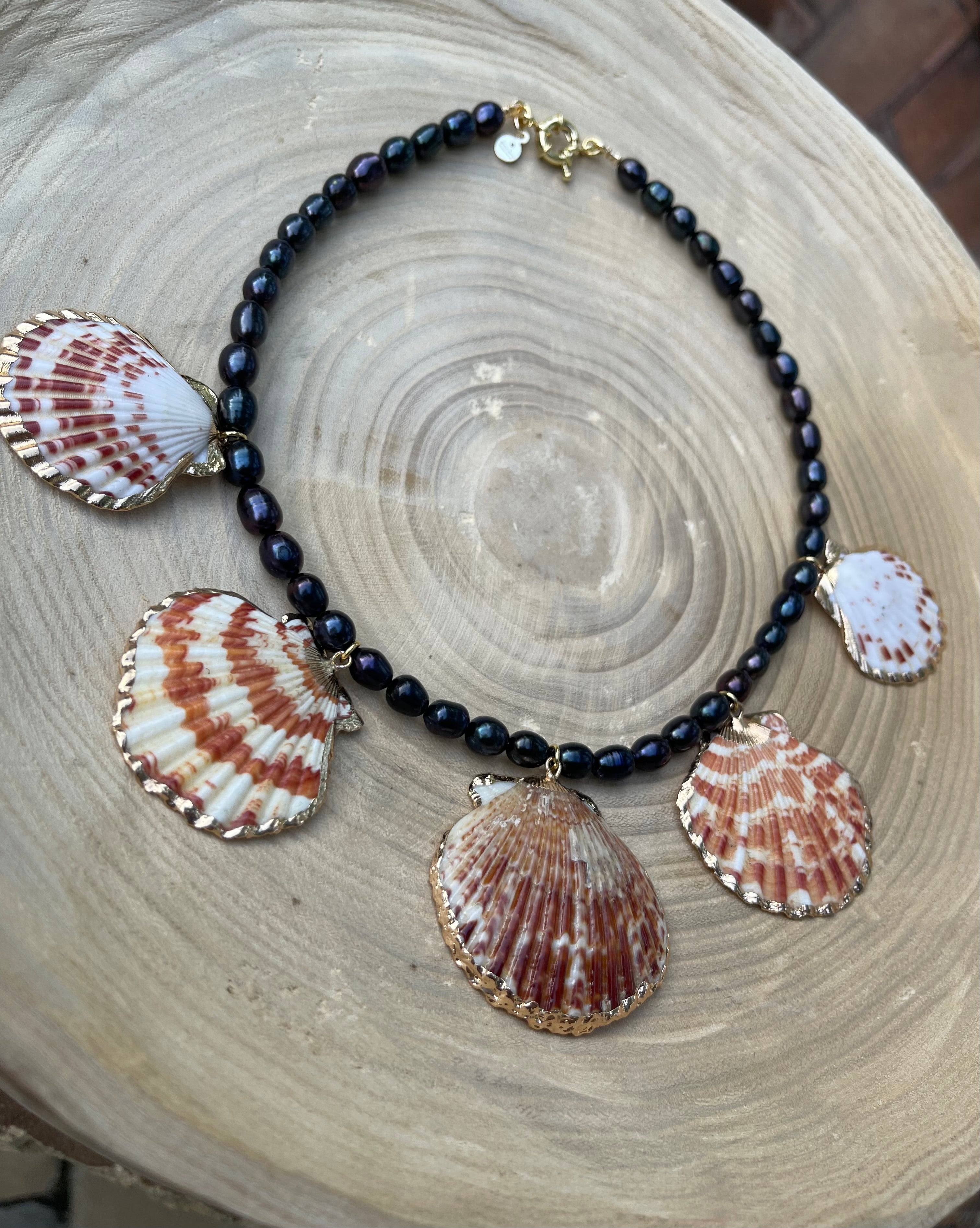 Midnight on the Beach Necklace: Midnight blue freshwater pearls with natural Lions Paw seashell pendants