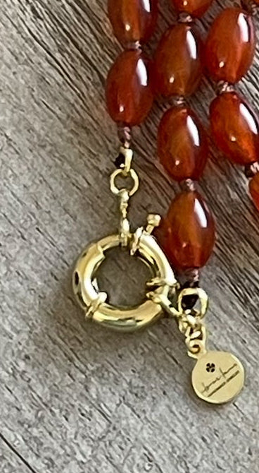 Carnelian Heartlock Necklace: Carnelian gemstone oval beads handknotted on warm brown silk GF heart pendant