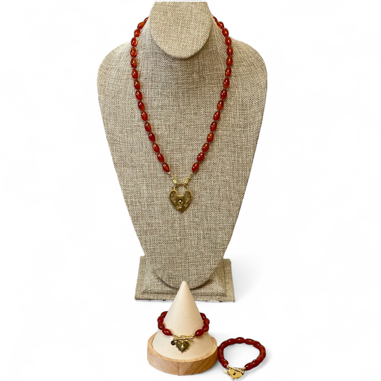 Carnelian Heartlock Necklace: Carnelian gemstone oval beads handknotted on warm brown silk GF heart pendant