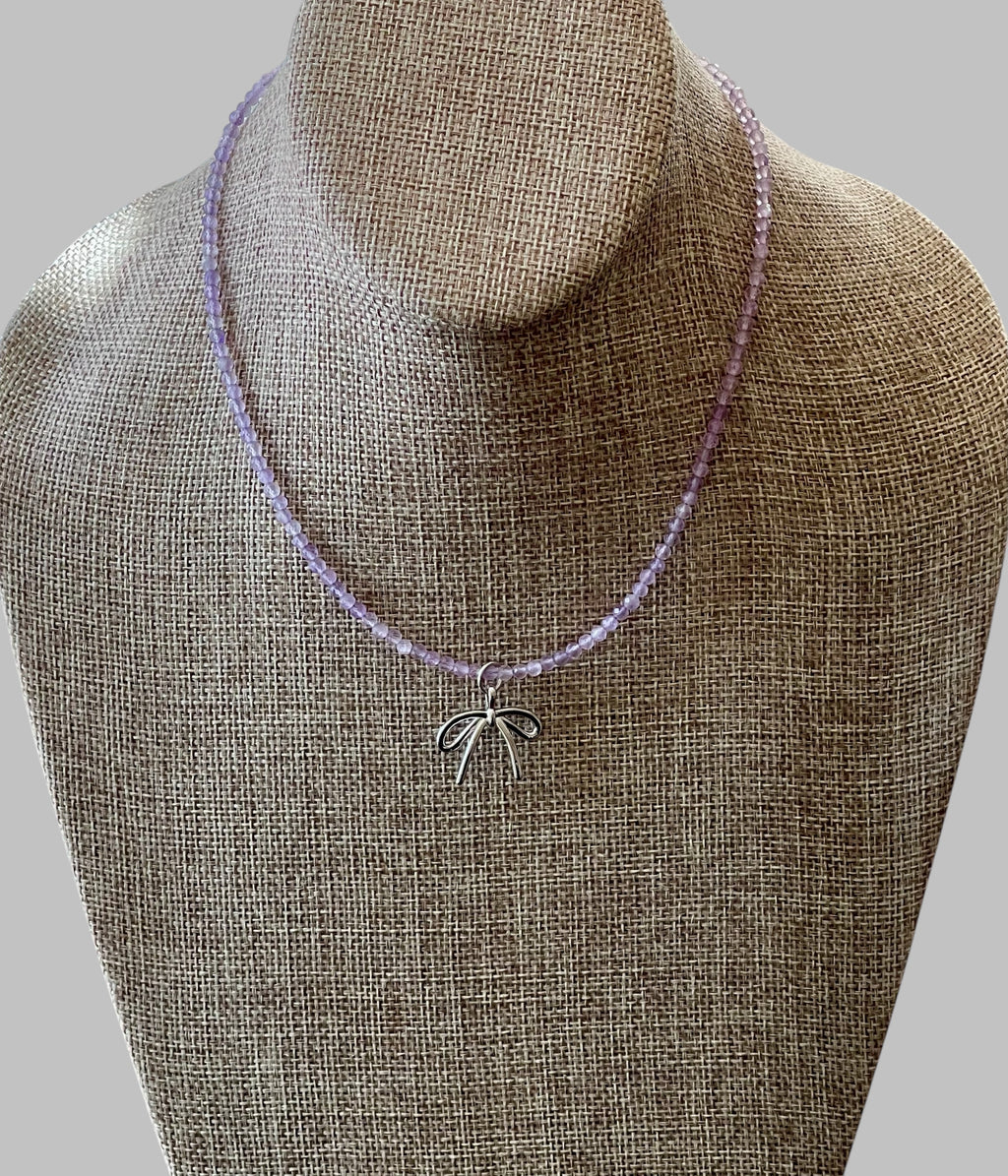 The Amethyst Skinny: Faceted Amethyst gemstones with a bow charm in Gold or Silver