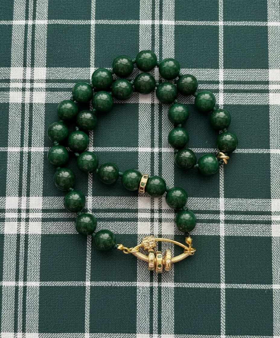 Vintage Vogue Necklace: Vintage Chinese Jade beads hand-knotted on matching satin cord•Gold pavé accents and charms
