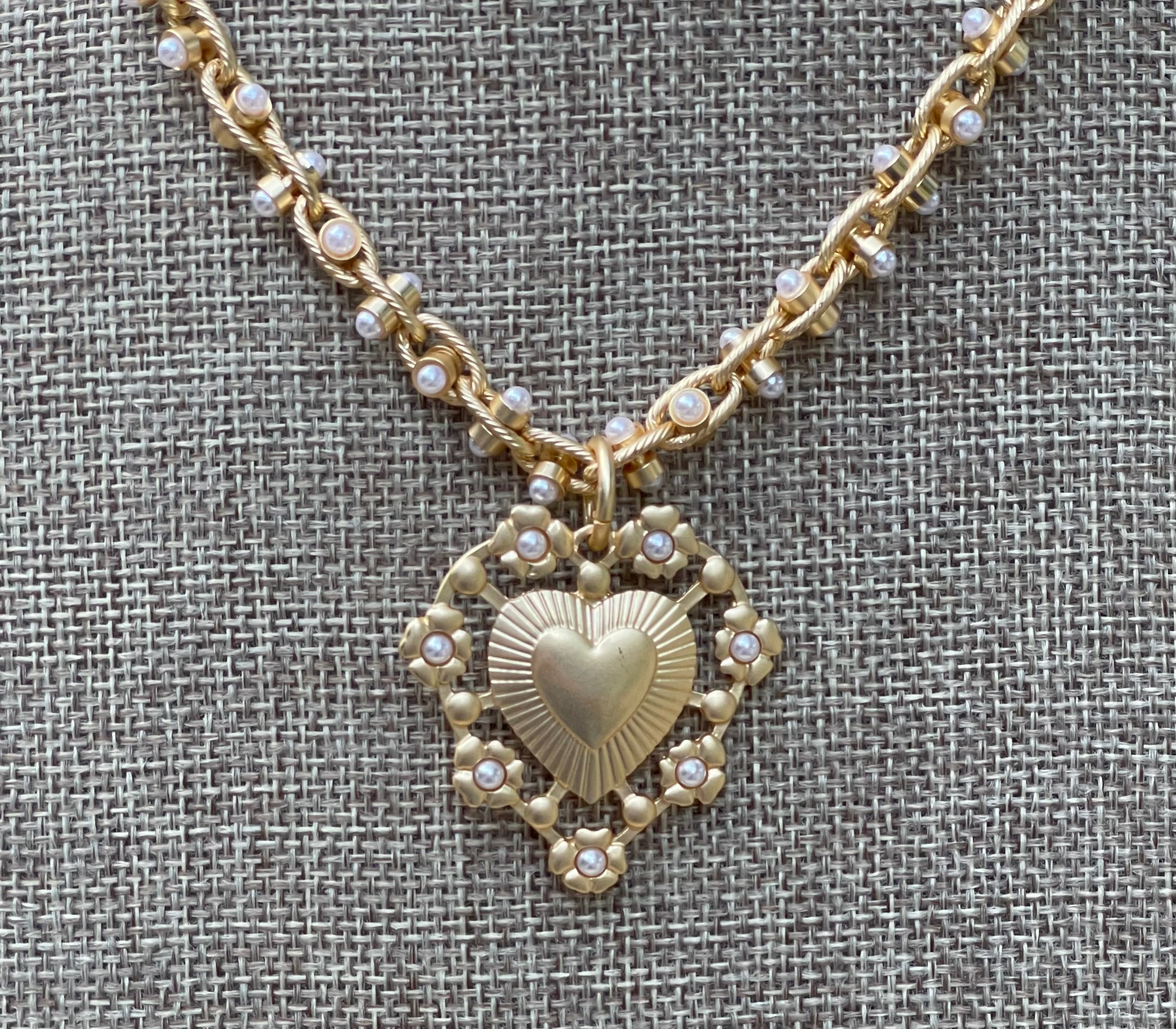 Bold Bijoux in Gold Necklace: Matte gold throughout Tiny pearls Statement heart