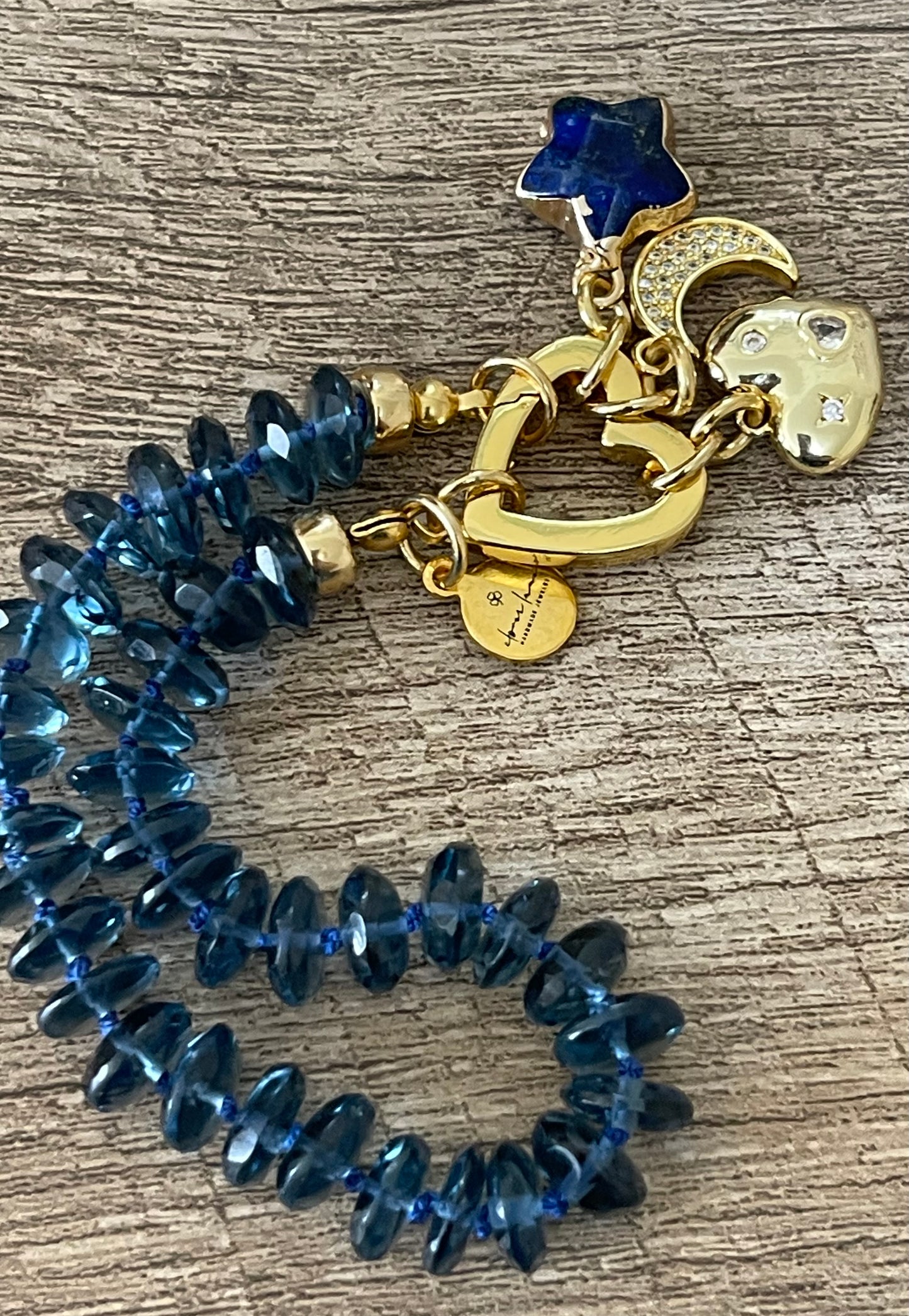 London Blue Bracelet: Hand knotted London Blue Topaz faceted gemstone beads Gold heart clasp with Lapis Lazuli star, Pavé moon and CZ accent heart charms OOAK