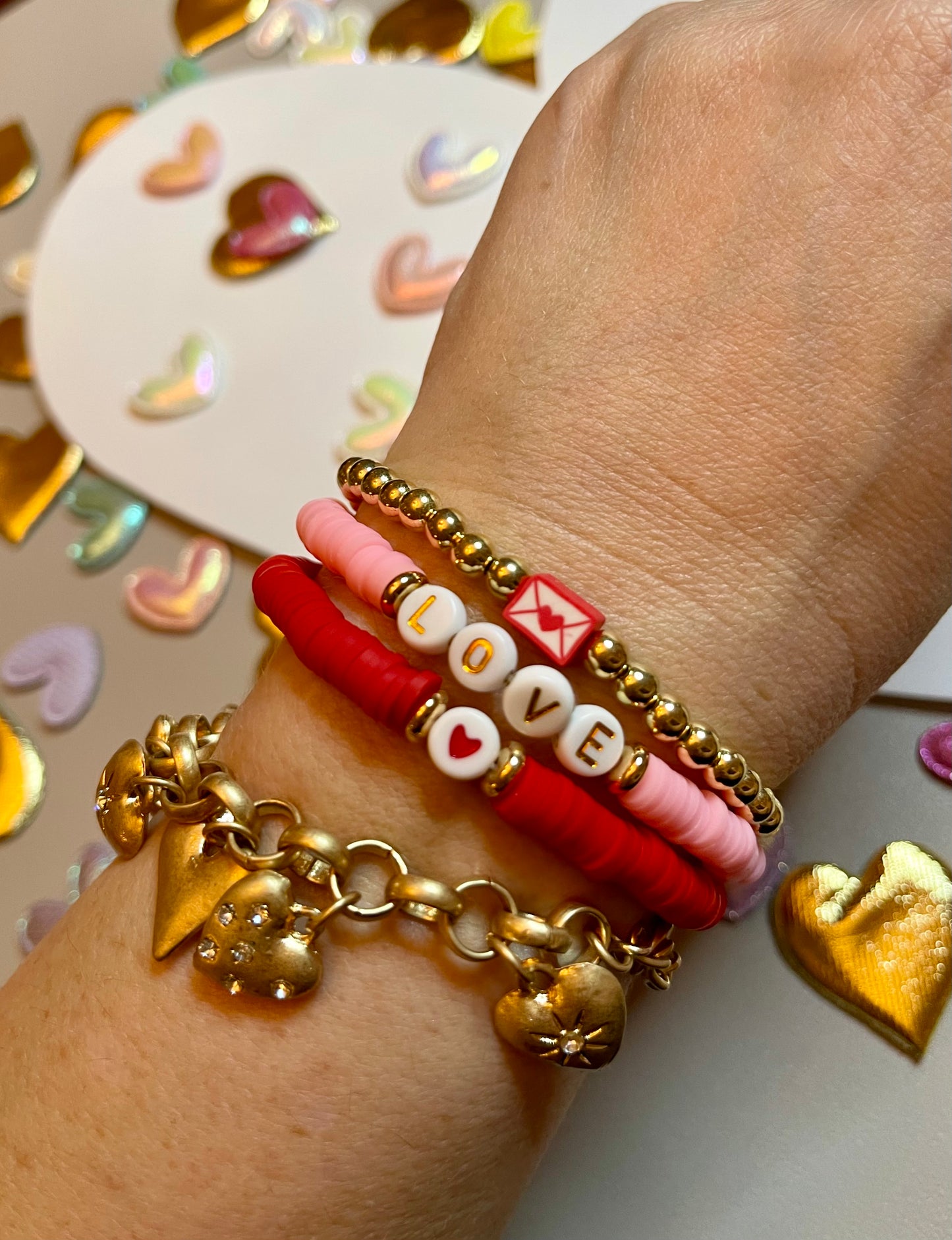 Love Stack 1: Red&Pink clay bead bracelets with acrylic letter beads and a gold plated bead bracelet featuring a love letter charm