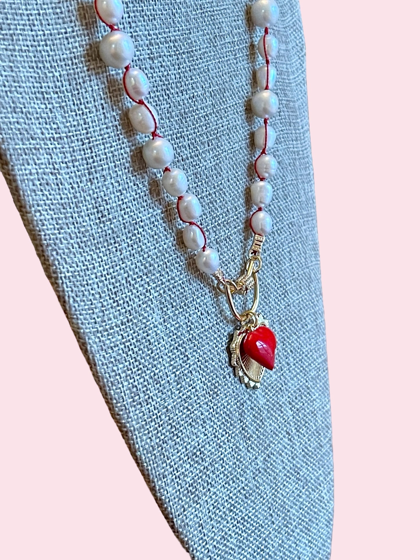 The Heartstrings Necklace: Luminous high quality freshwater pearls hand knotted on red silk w/ gold and red enameled heart charms, pavé accented clasp/charm holder OOAK