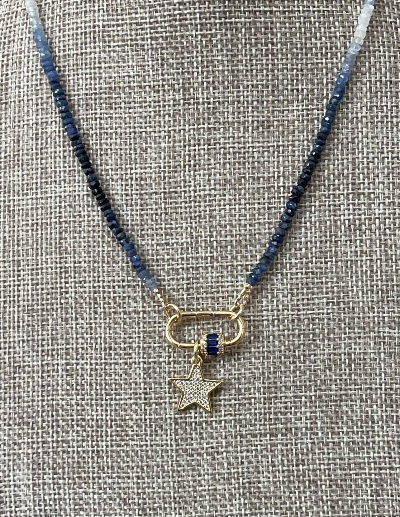 Starlight Path Necklace: Faceted Sapphire Gemstone beads in an ombré pattern, Gold carabiner with deep blue CZ’s, Gold pavé star charm OOAK
