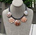 Midnight on the Beach Necklace: Midnight blue freshwater pearls with natural Lions Paw seashell pendants