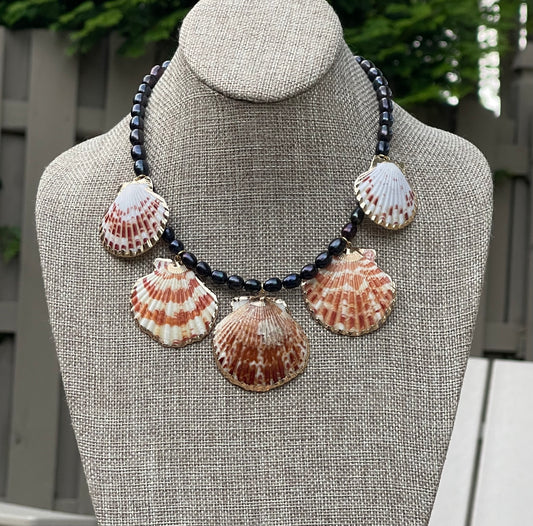 Midnight on the Beach Necklace: Midnight blue freshwater pearls with natural Lions Paw seashell pendants