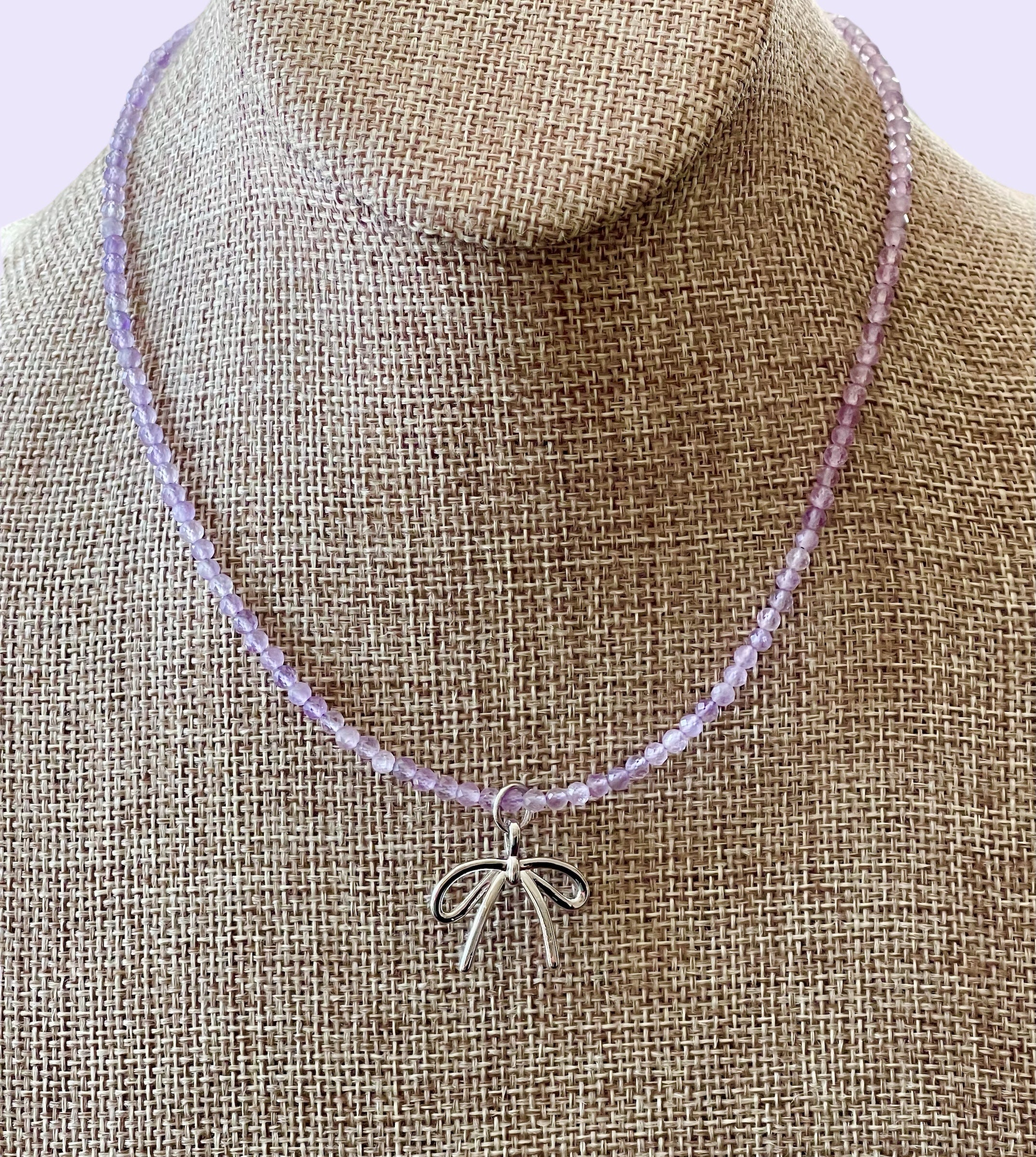 The Amethyst Skinny: Faceted Amethyst gemstones with a bow charm in Gold or Silver