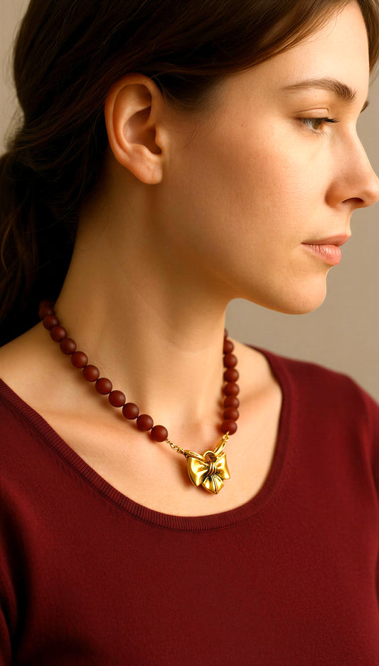 Matte Carnelian Bow Necklace: Matte Carnelian gemstone beads Antiqued gold bow pendant