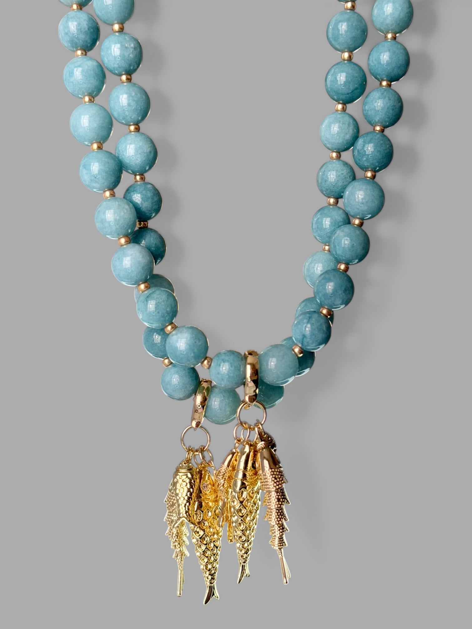 The Golden Catch Necklace: Sea blue Jade with Gold Fish Charms