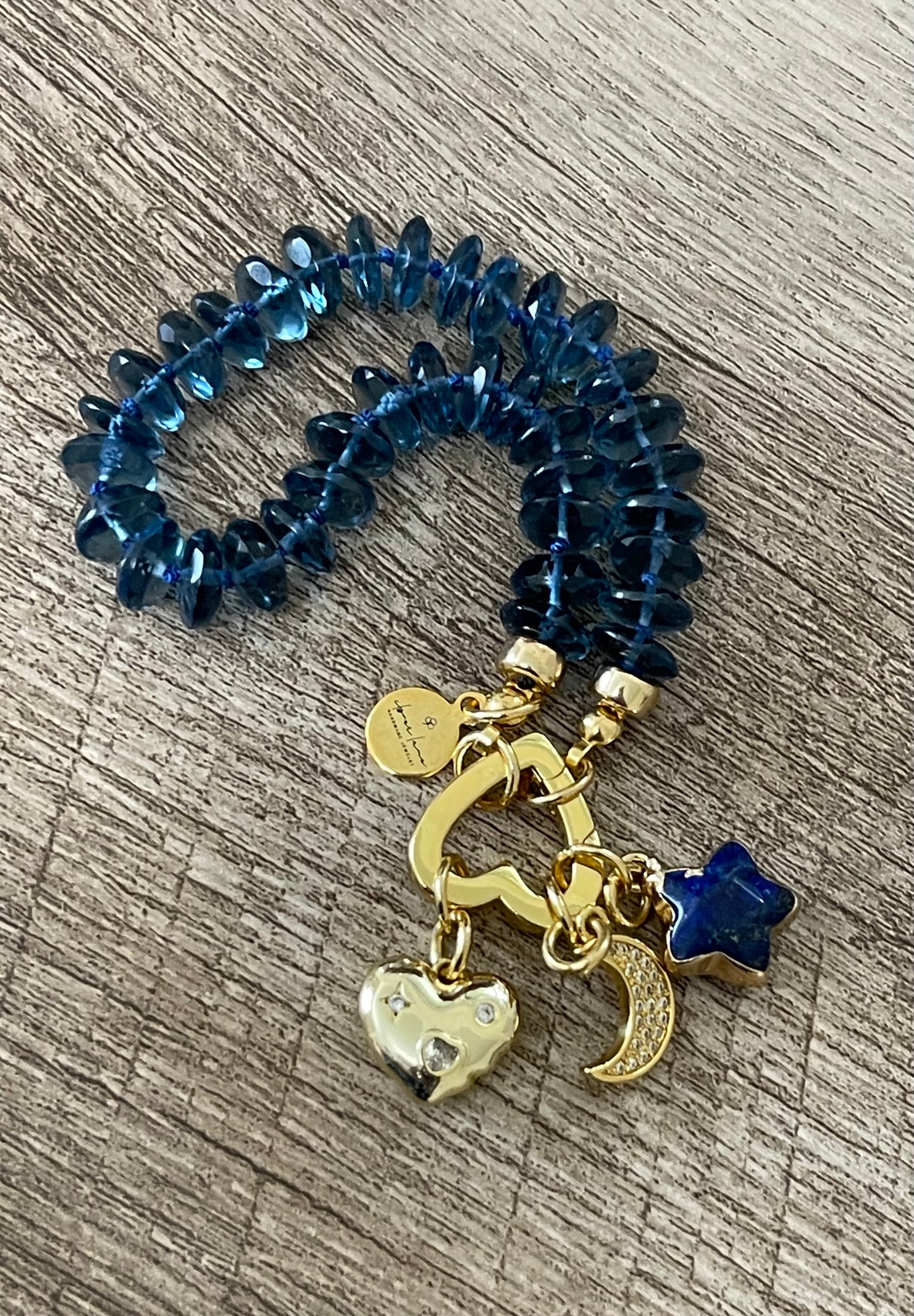 London Blue Bracelet: Hand knotted London Blue Topaz faceted gemstone beads Gold heart clasp with Lapis Lazuli star, Pavé moon and CZ accent heart charms OOAK