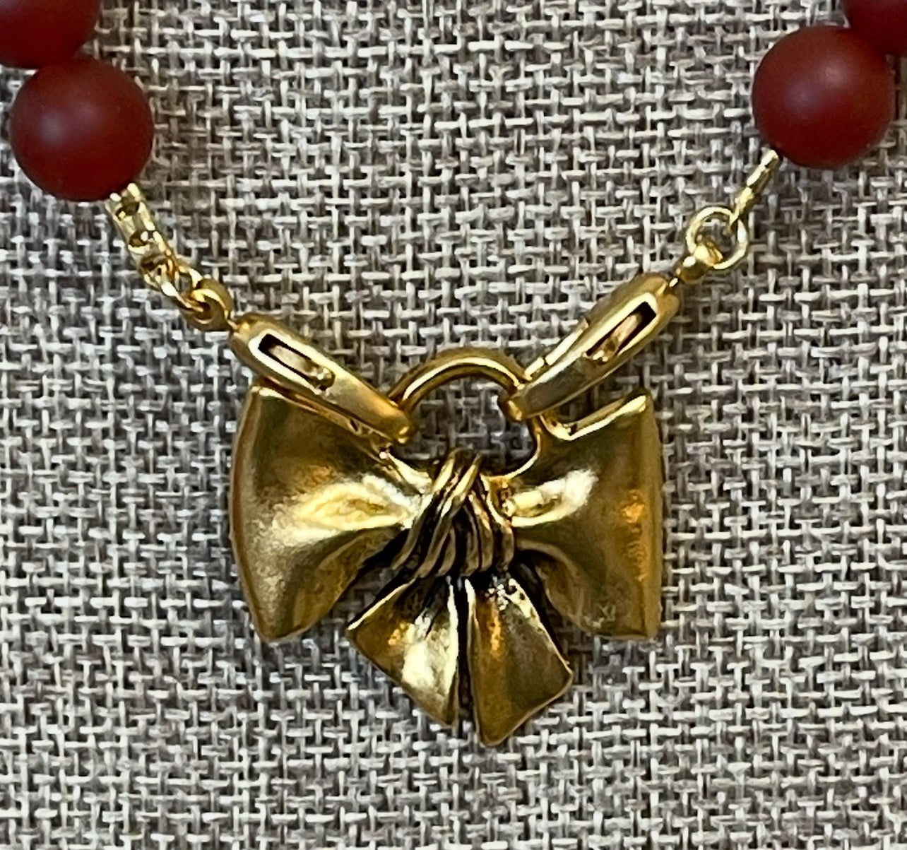 Matte Carnelian Bow Necklace: Matte Carnelian gemstone beads Antiqued gold bow pendant