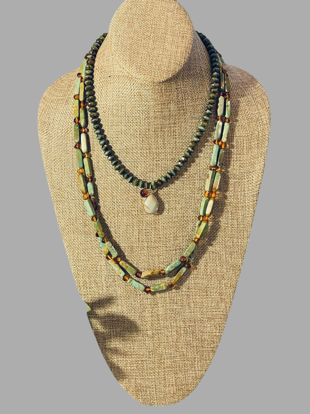 Verdant Glow Necklace: Turquoise and Baltic Amber stone with gold toggle clasp