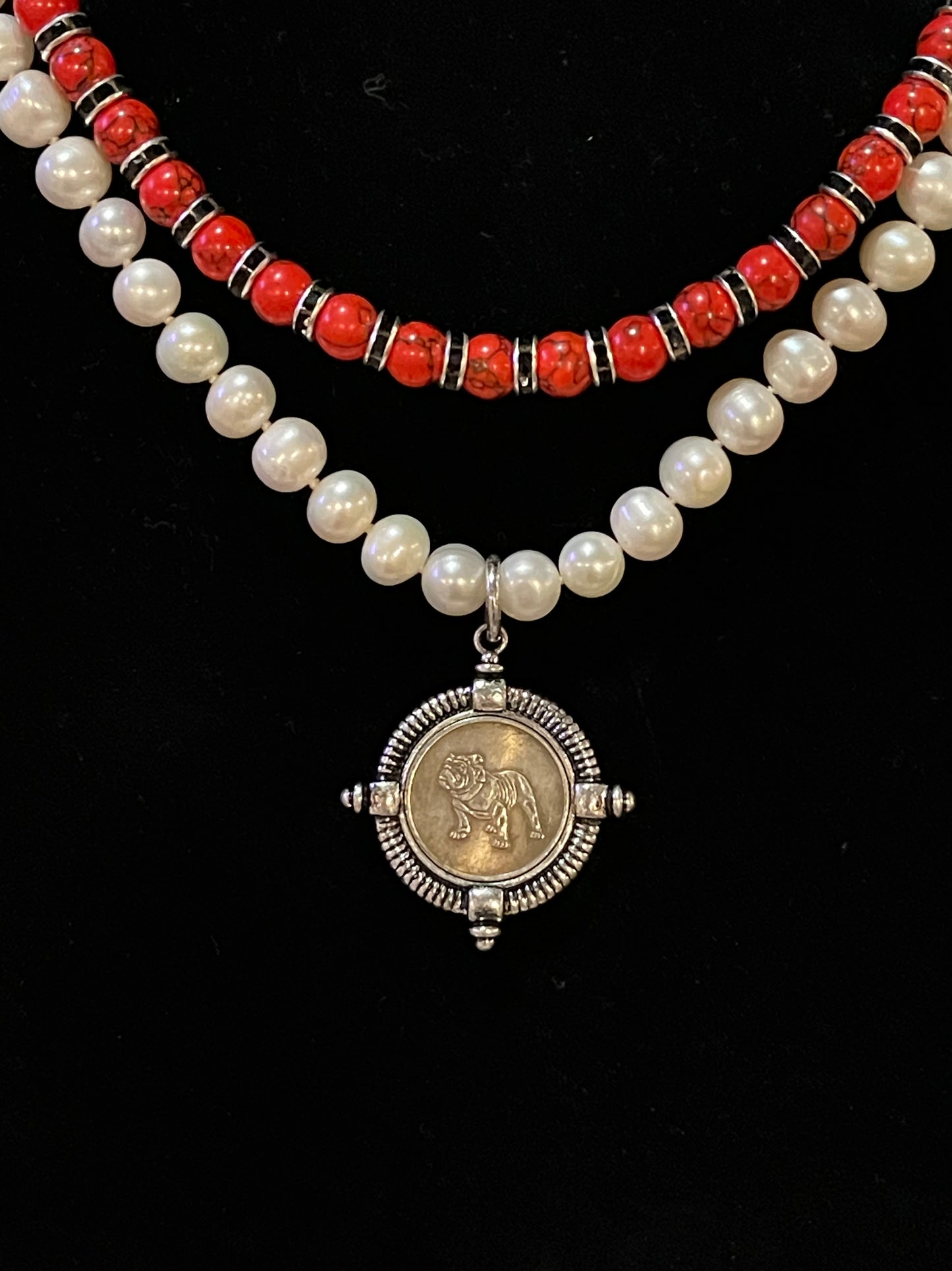 Go Dawgs Necklace: Hand-knotted Freshwater Pearls layered with Red & black marbled beads accented by black sparkling spacer beads and a chic coin-style Bulldog pendant Pinch clasp