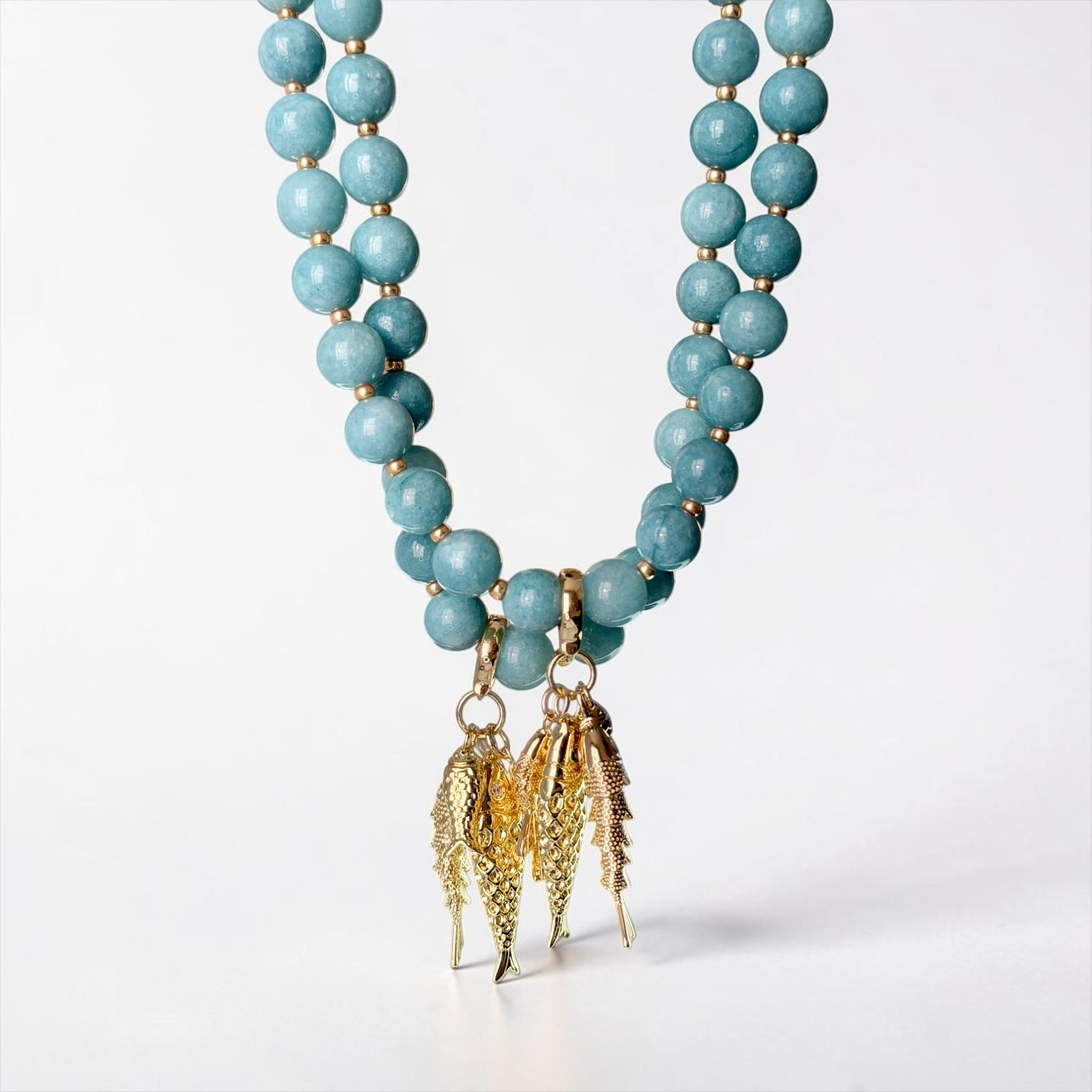 The Golden Catch Necklace: Sea blue Jade with Gold Fish Charms