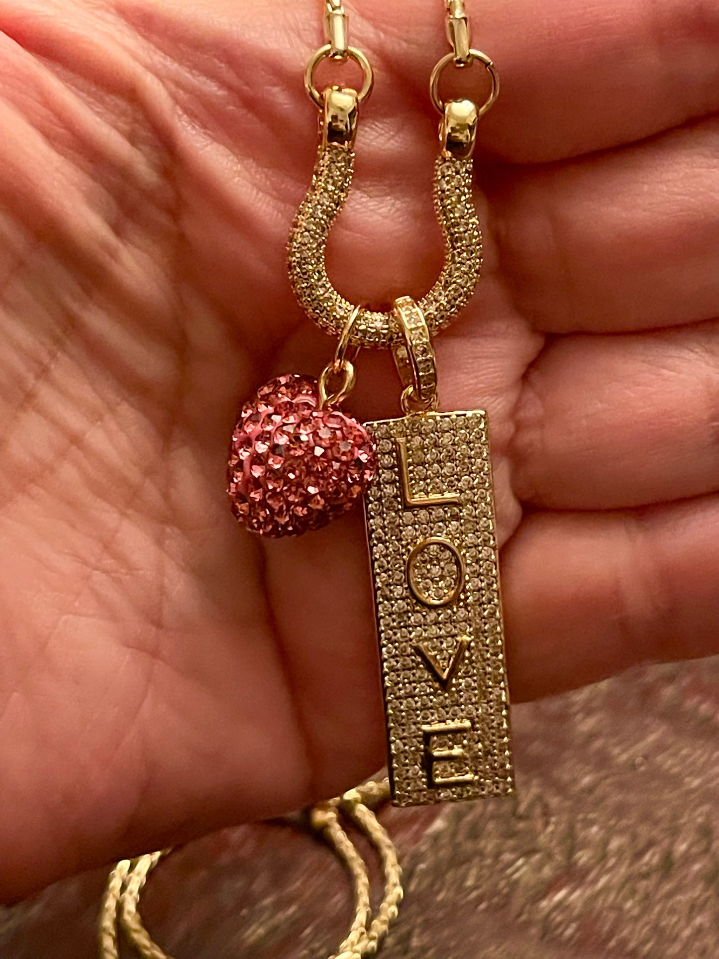 OOAK Stirrup of Love Charm Holder Necklace: Cobra chain with a pavé stirrup holding 2 charms- A pink sparkle 3D heart and a pavé LOVE sign