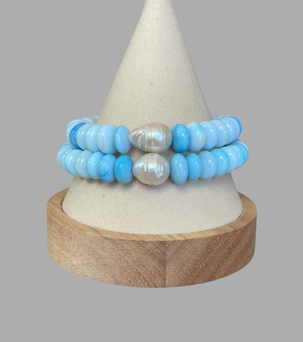 Robin’s Egg Opal Bracelet: Robin’s egg blue Opals with a Baroque Pearl center Gold clasp