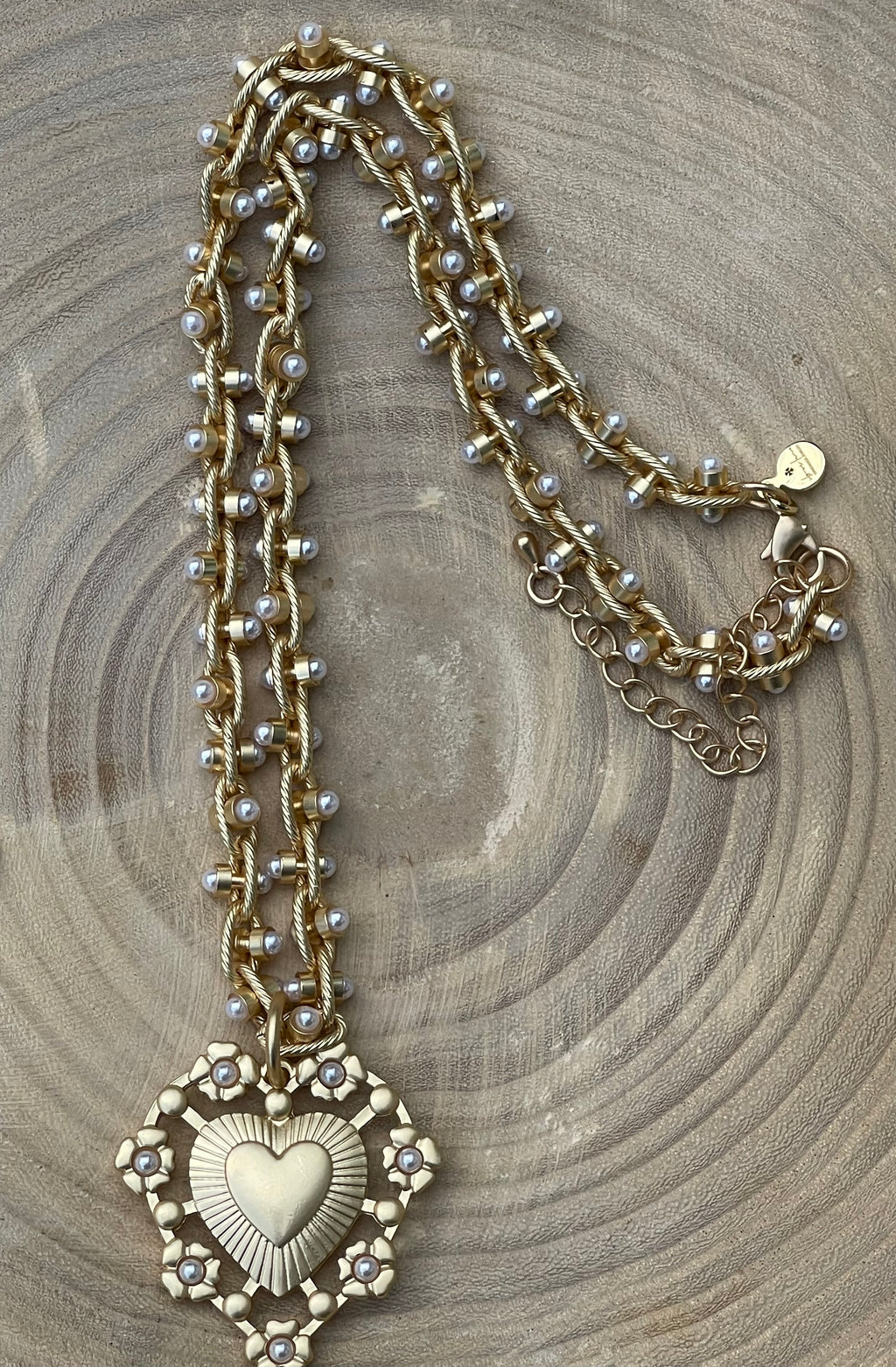 Bold Bijoux in Gold Necklace: Matte gold throughout Tiny pearls Statement heart