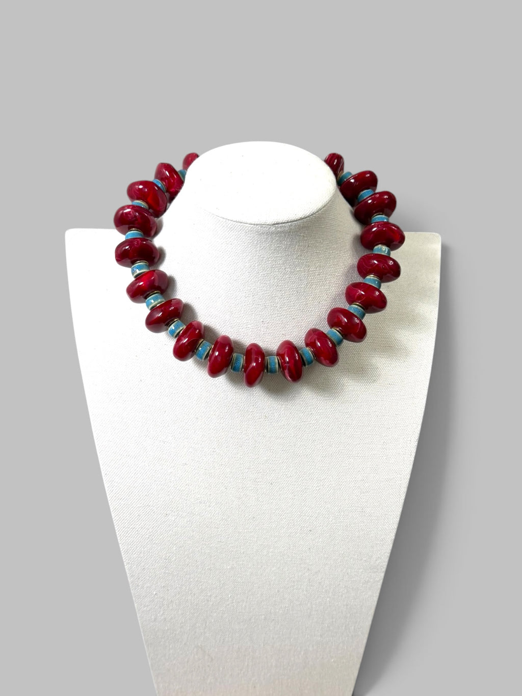 Crimson & Coast: Resin and Ceramic beads with gold brass accents and clasp
