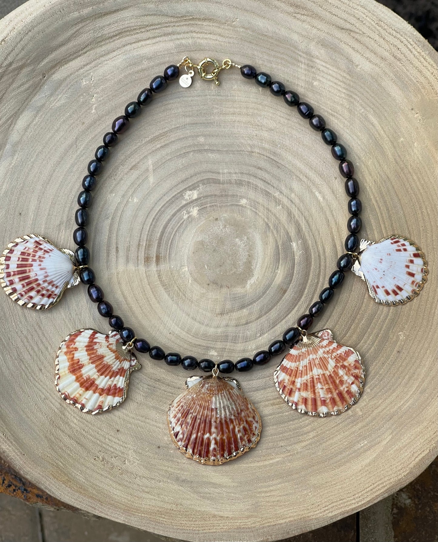 Midnight on the Beach Necklace: Midnight blue freshwater pearls with natural Lions Paw seashell pendants