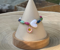 Kindred Colors Bracelet: Recycled paper bicone shaped beads, glass spacer beads, shiny white heart and flower charm