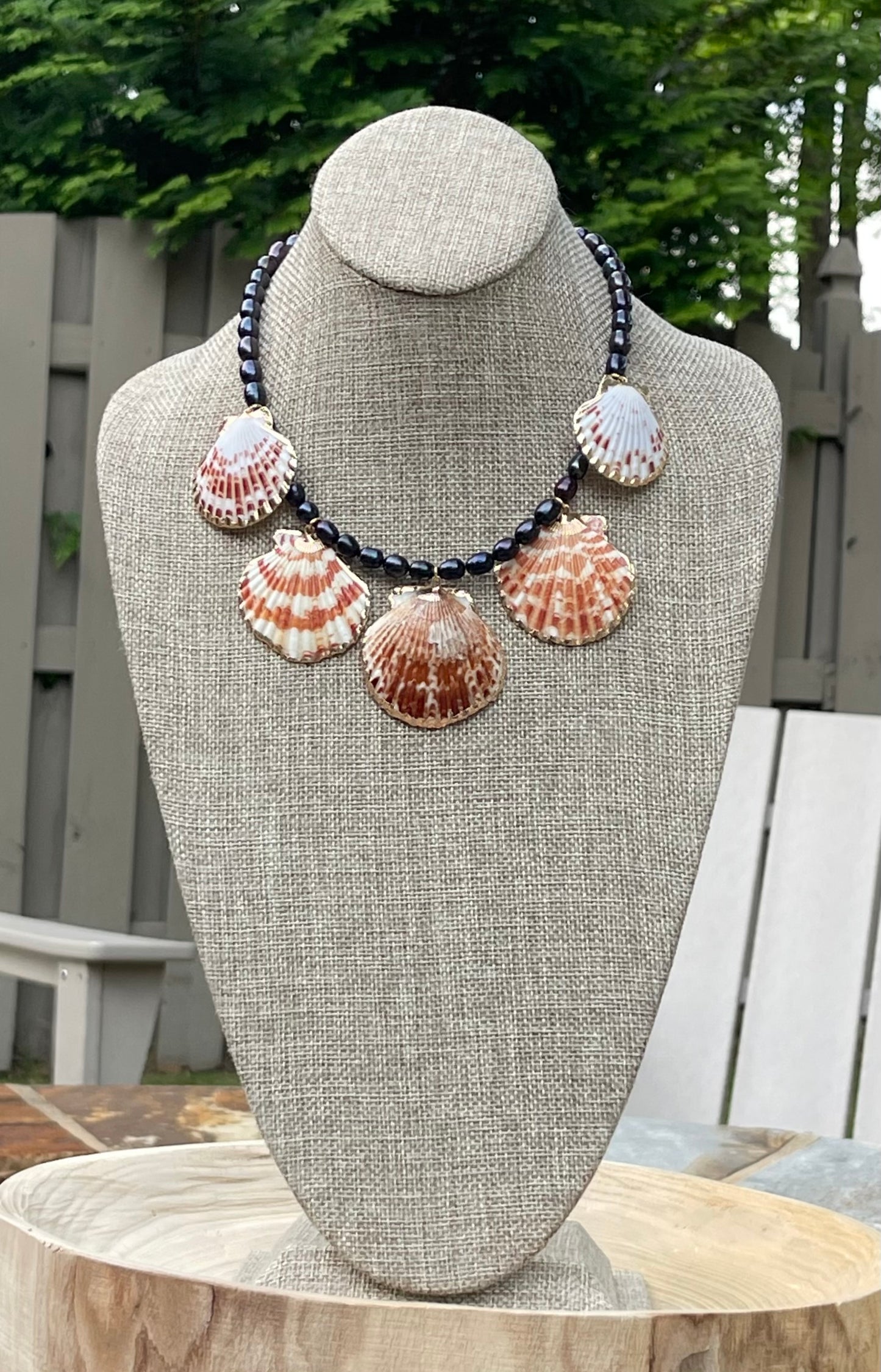 Midnight on the Beach Necklace: Midnight blue freshwater pearls with natural Lions Paw seashell pendants