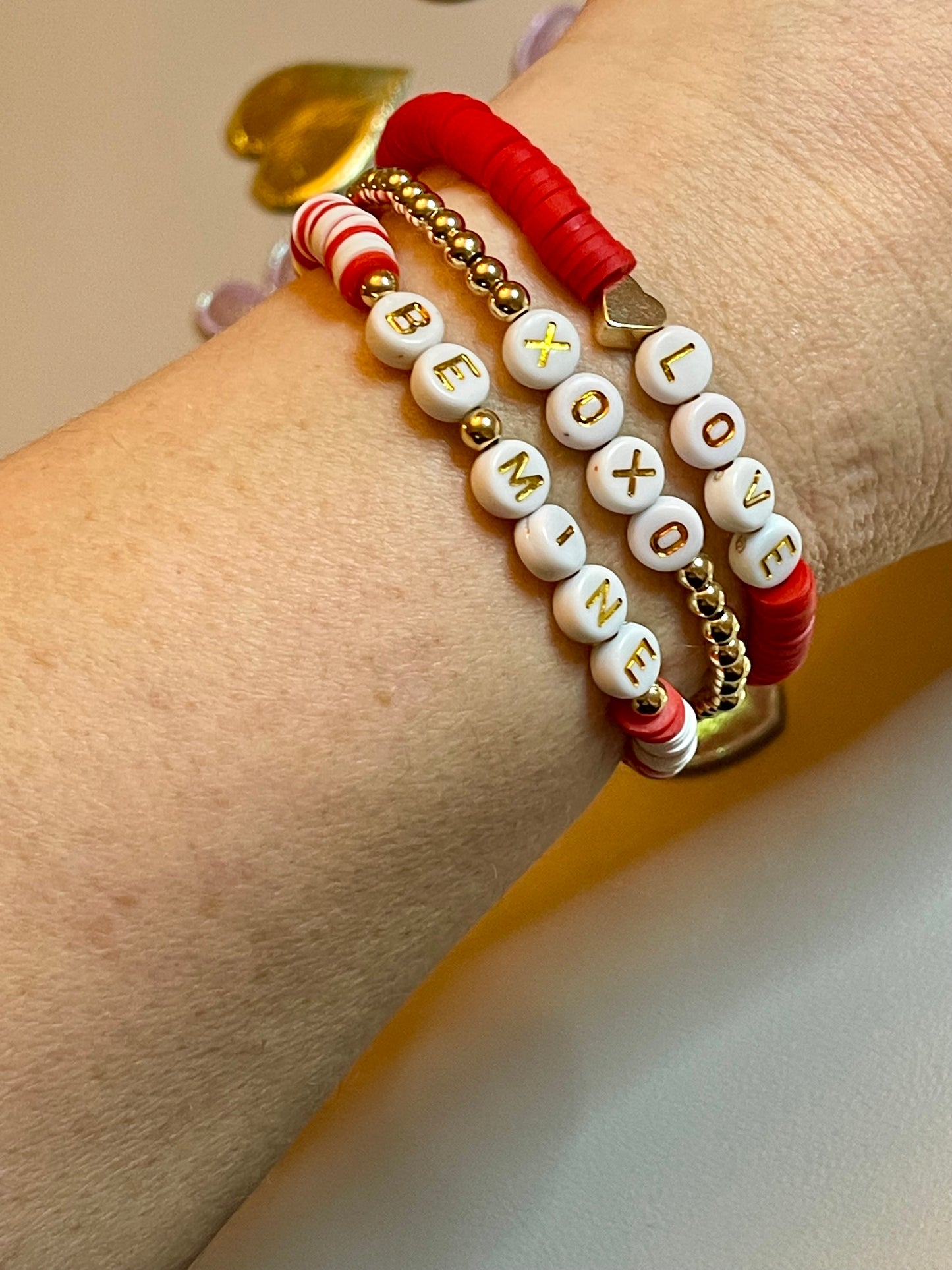 Love Stack 2: Red&white clay bead stretch bracelets and a gold plated bead bracelet, all with letter beads