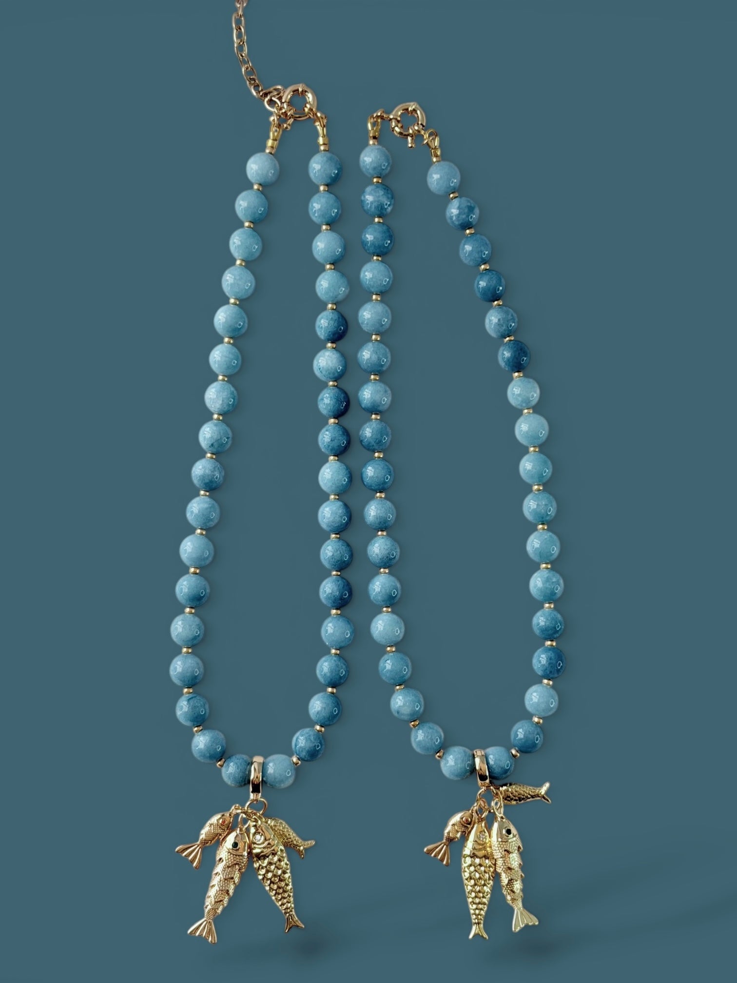 The Golden Catch Necklace: Sea blue Jade with Gold Fish Charms
