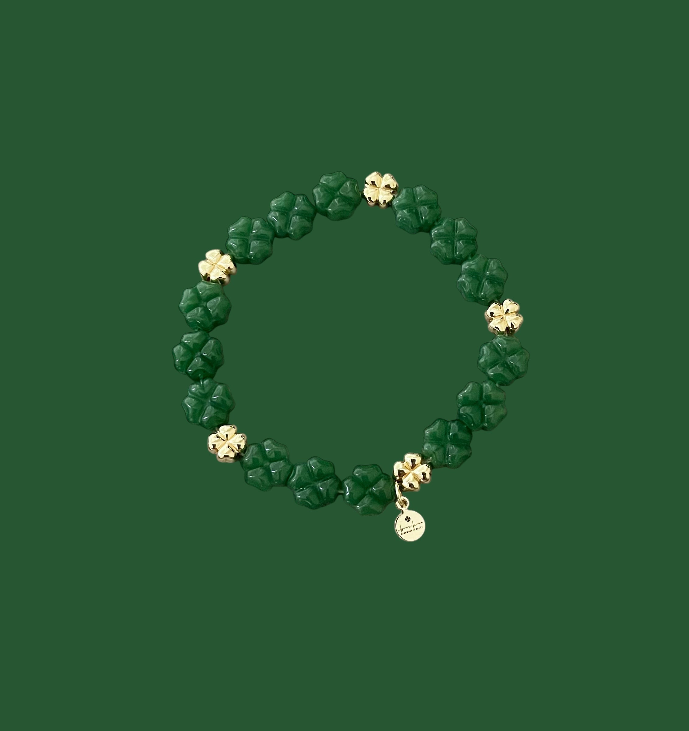 Green Glass and Gold Shamrock bracelet: A stretch bracelet made with glass carved beads and gold filled brass accent beads FREE SHIPPING!