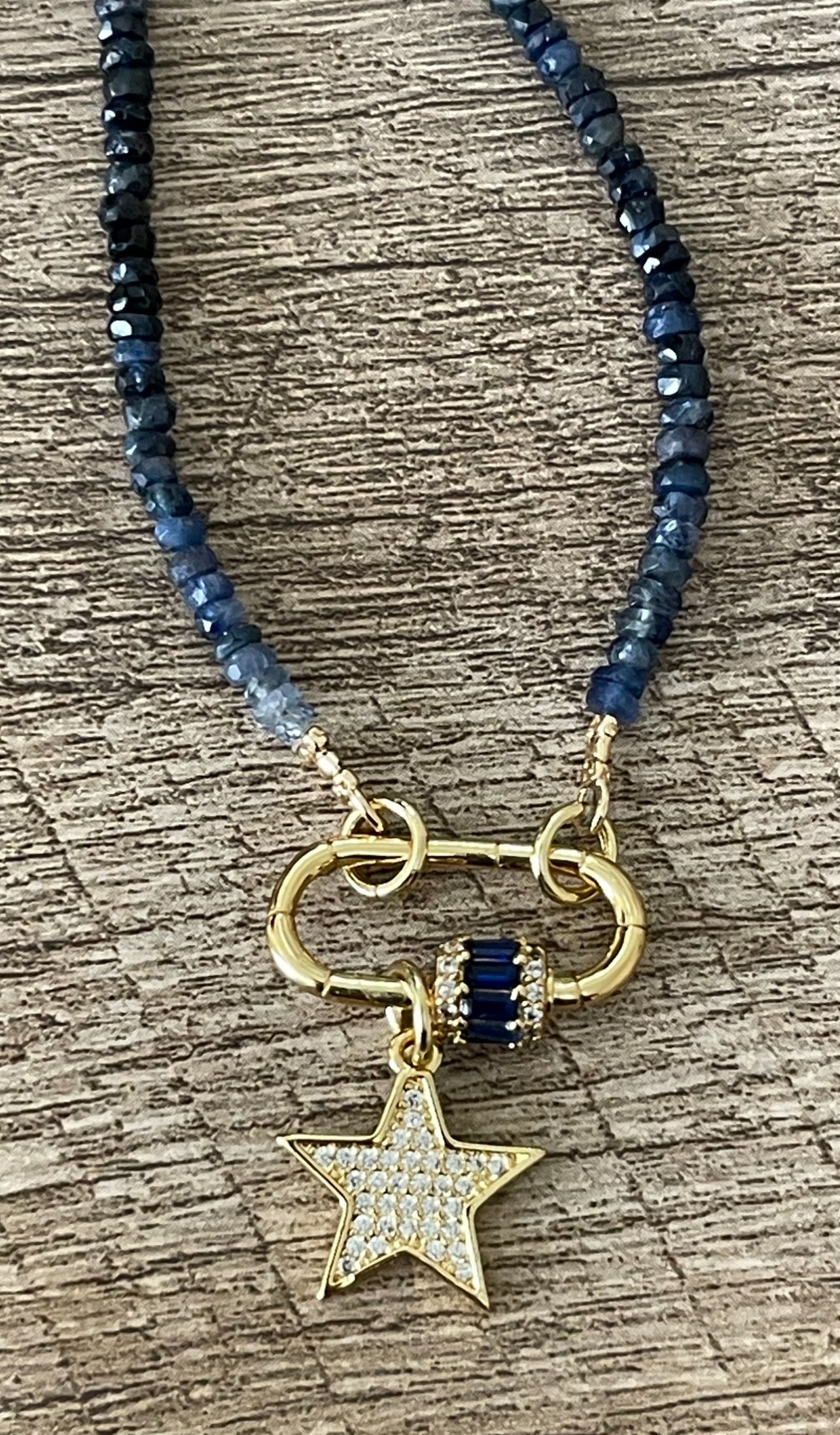 Starlight Path Necklace: Faceted Sapphire Gemstone beads in an ombré pattern, Gold carabiner with deep blue CZ’s, Gold pavé star charm OOAK