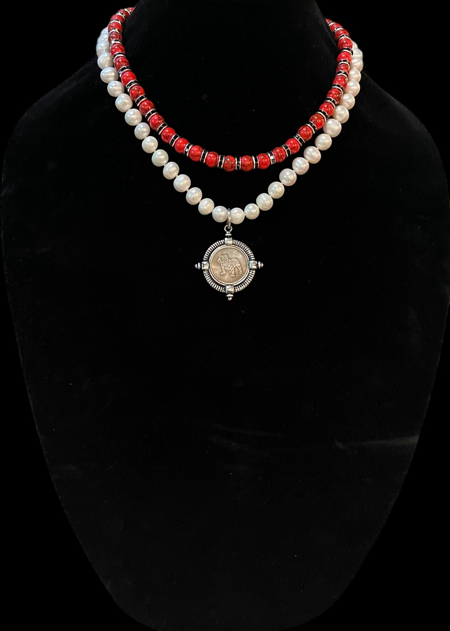 Go Dawgs Necklace: Hand-knotted Freshwater Pearls layered with Red & black marbled beads accented by black sparkling spacer beads and a chic coin-style Bulldog pendant Pinch clasp